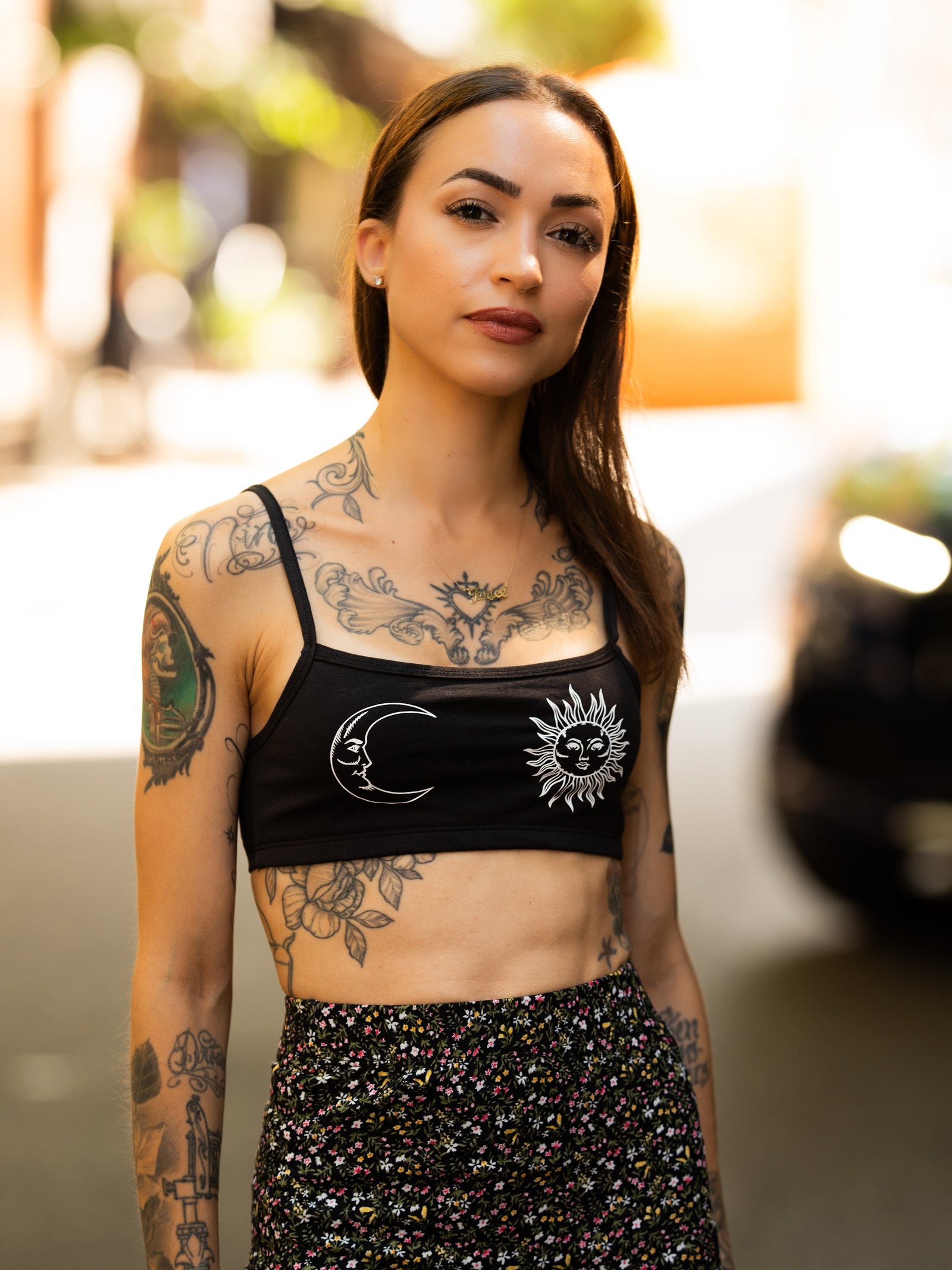 Janice Danger wearing the Sun and Moon black bralette with the Addicted to Love floral print skirt.