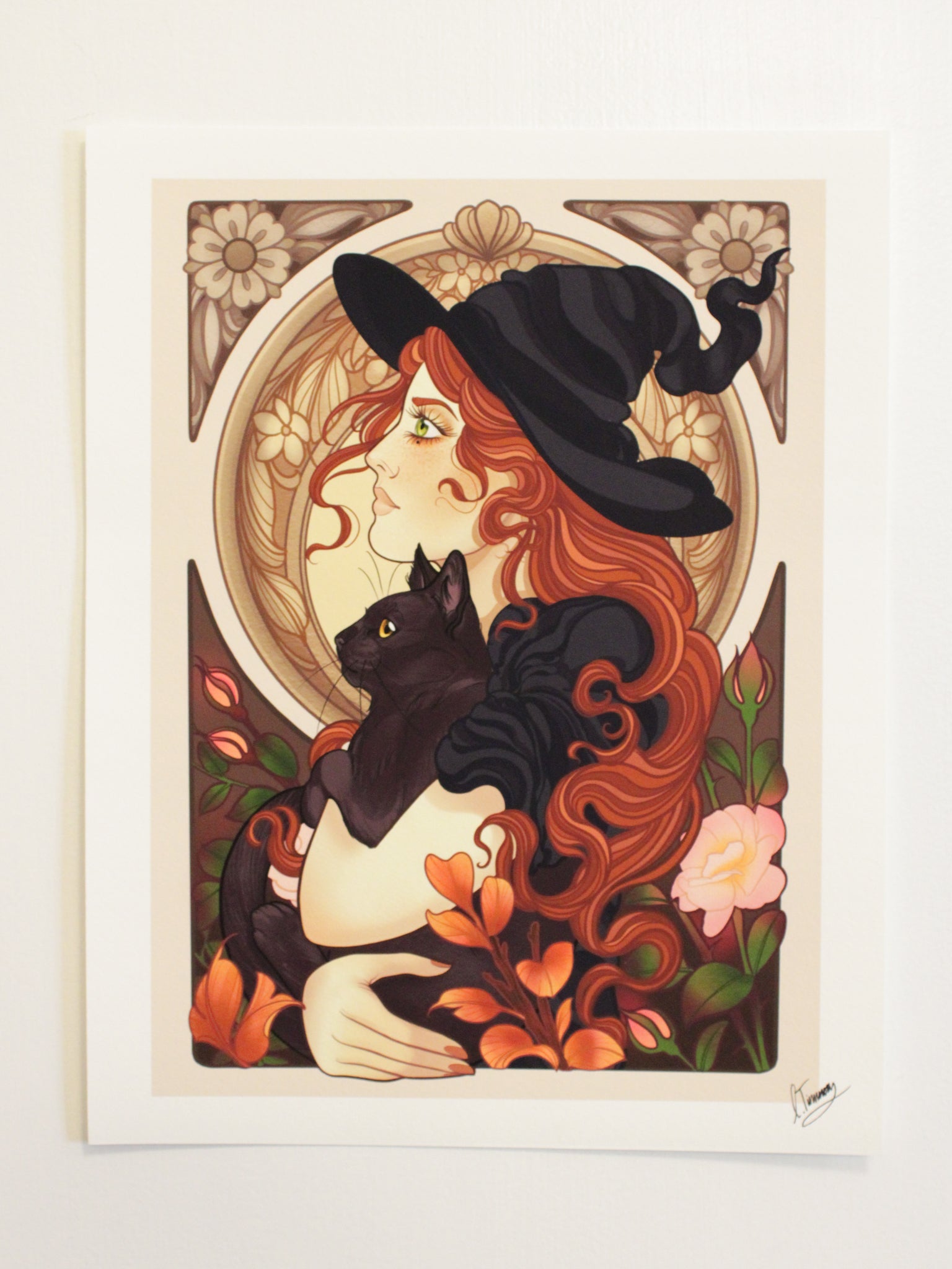 Charlotte Timmons neo-traditional style Witch fine art Print against a wolid white wall in direct artificial lighting to show color variation in different light scenarios.