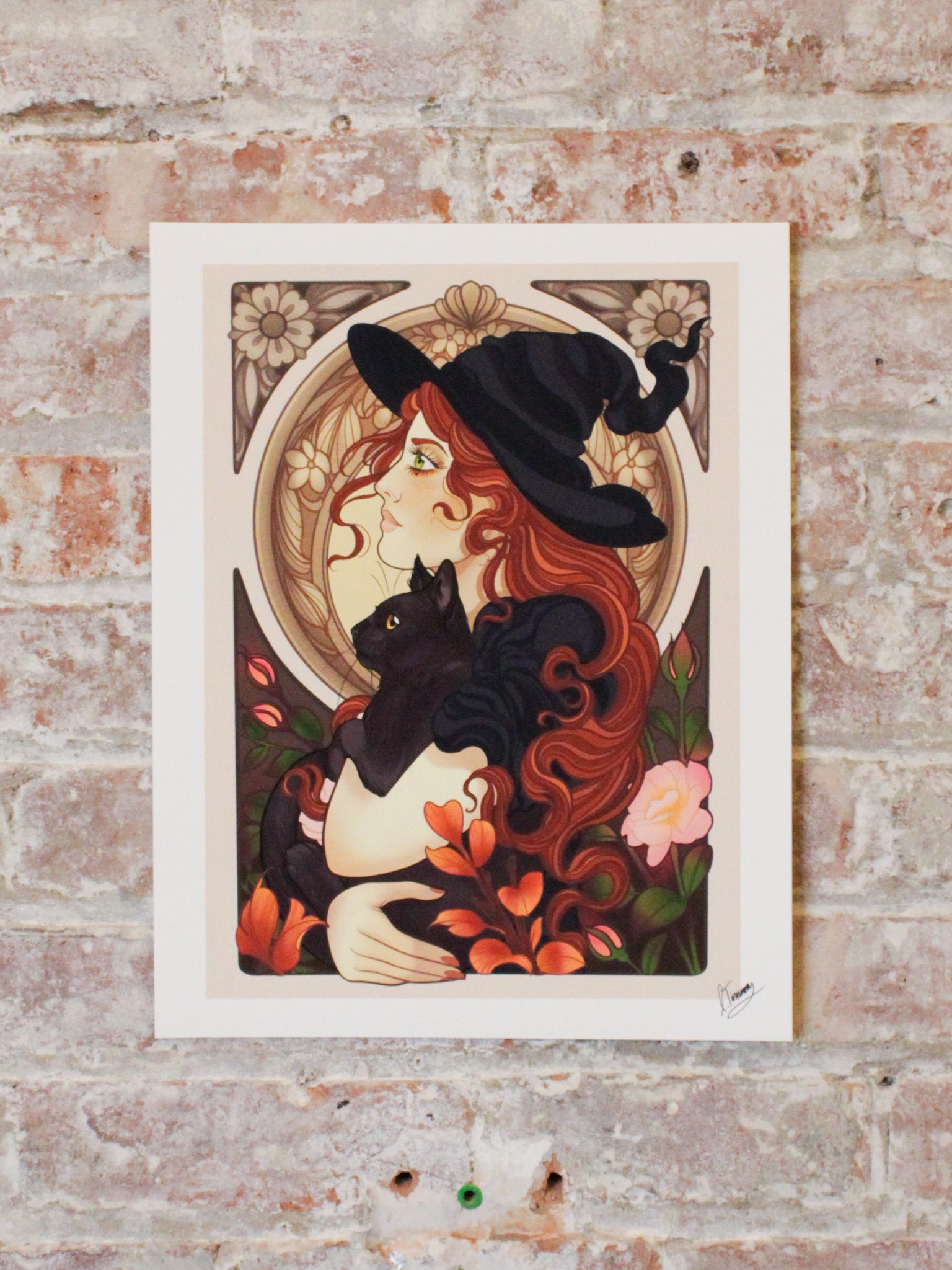 Charlotte Timmons neo-traditional style Witch fine art Print against a brick wall in muted lighting to show color variation in different light scenarios.