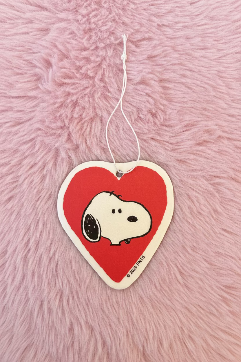 Heart-shaped air freshener with Snoopy in a red heart on a pink fuzzy background