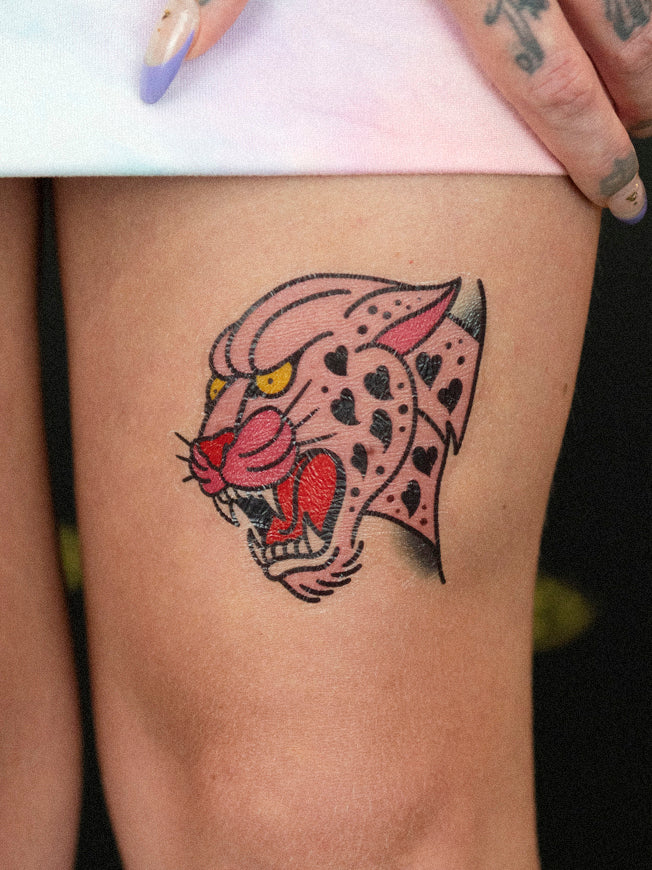 Pink panther with heart spots temporary tattoo designed by and placed on Megan Massacre