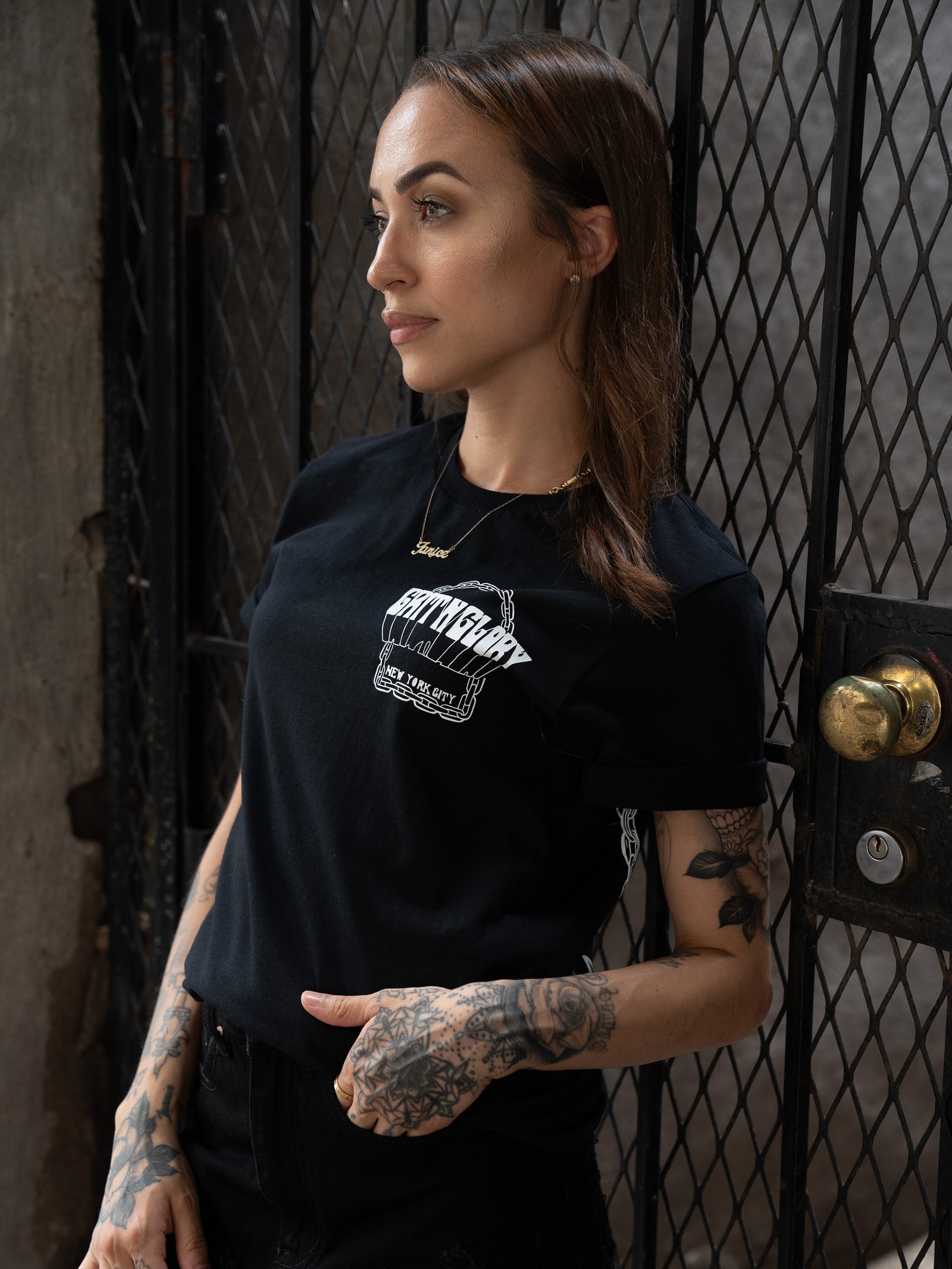 Janice Danger wearing a black unisex Grit N Glory t-shirt which reads Grit N Glory New York City