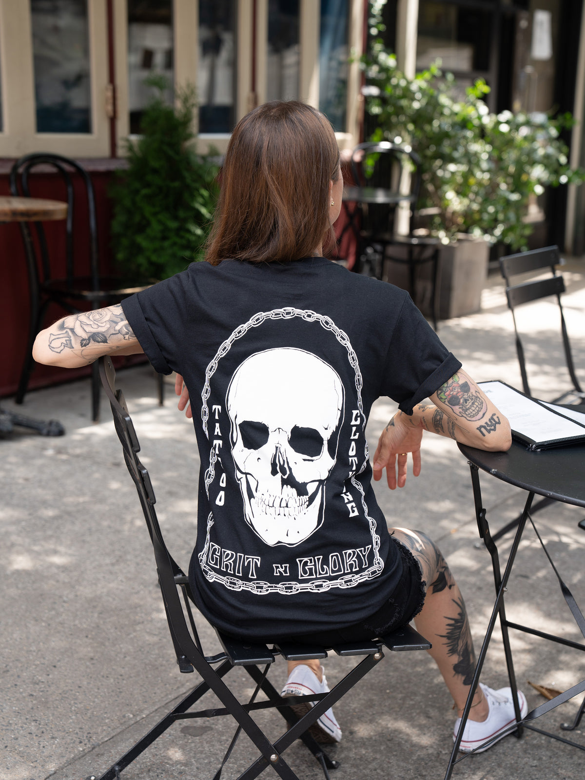 black t-shirt with Grit N Glory skull surrounded by chains 