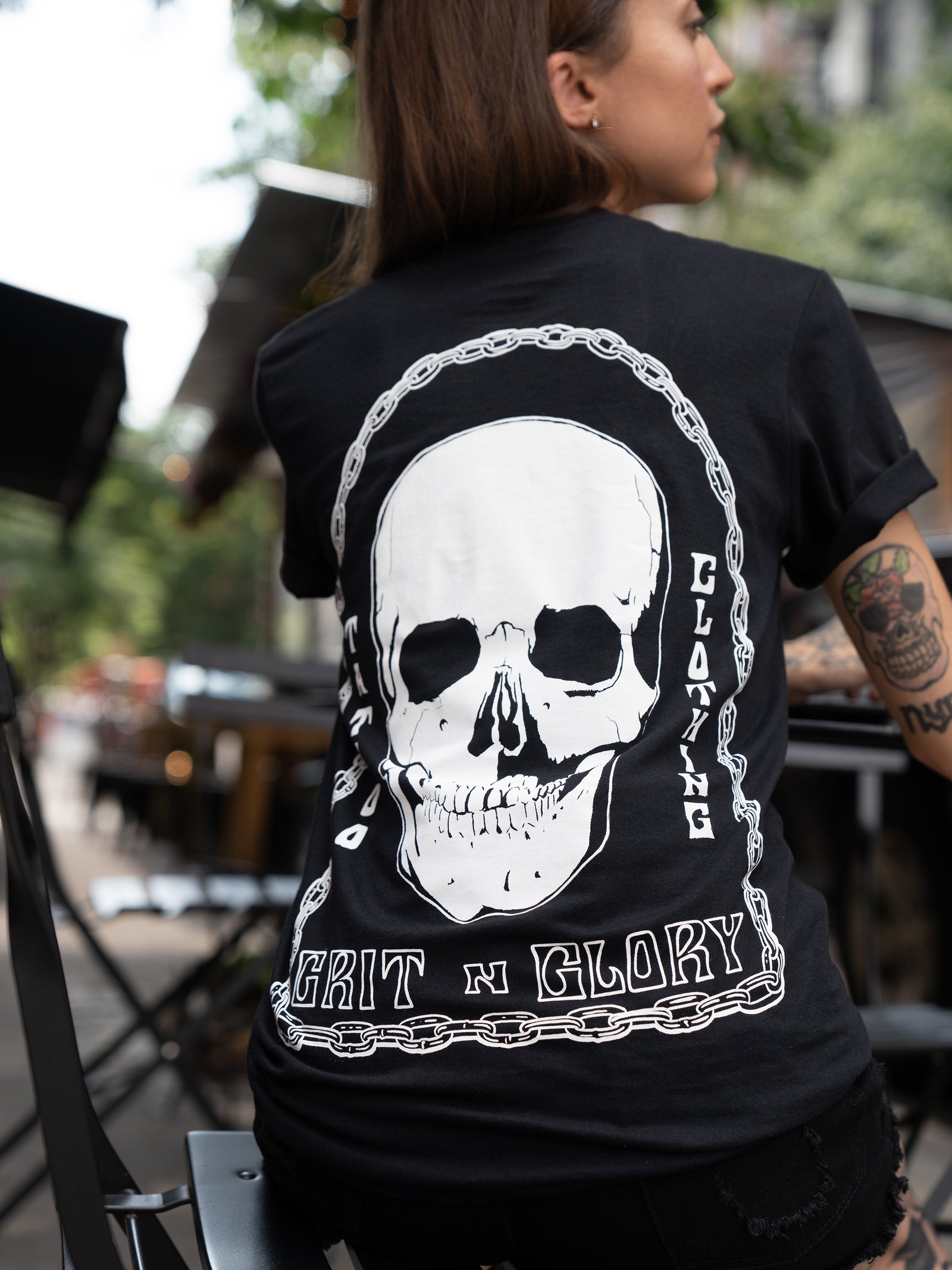 Black unisex t-shirt with chains and skull reads "Grit N Glory Tattoo Clothing"
