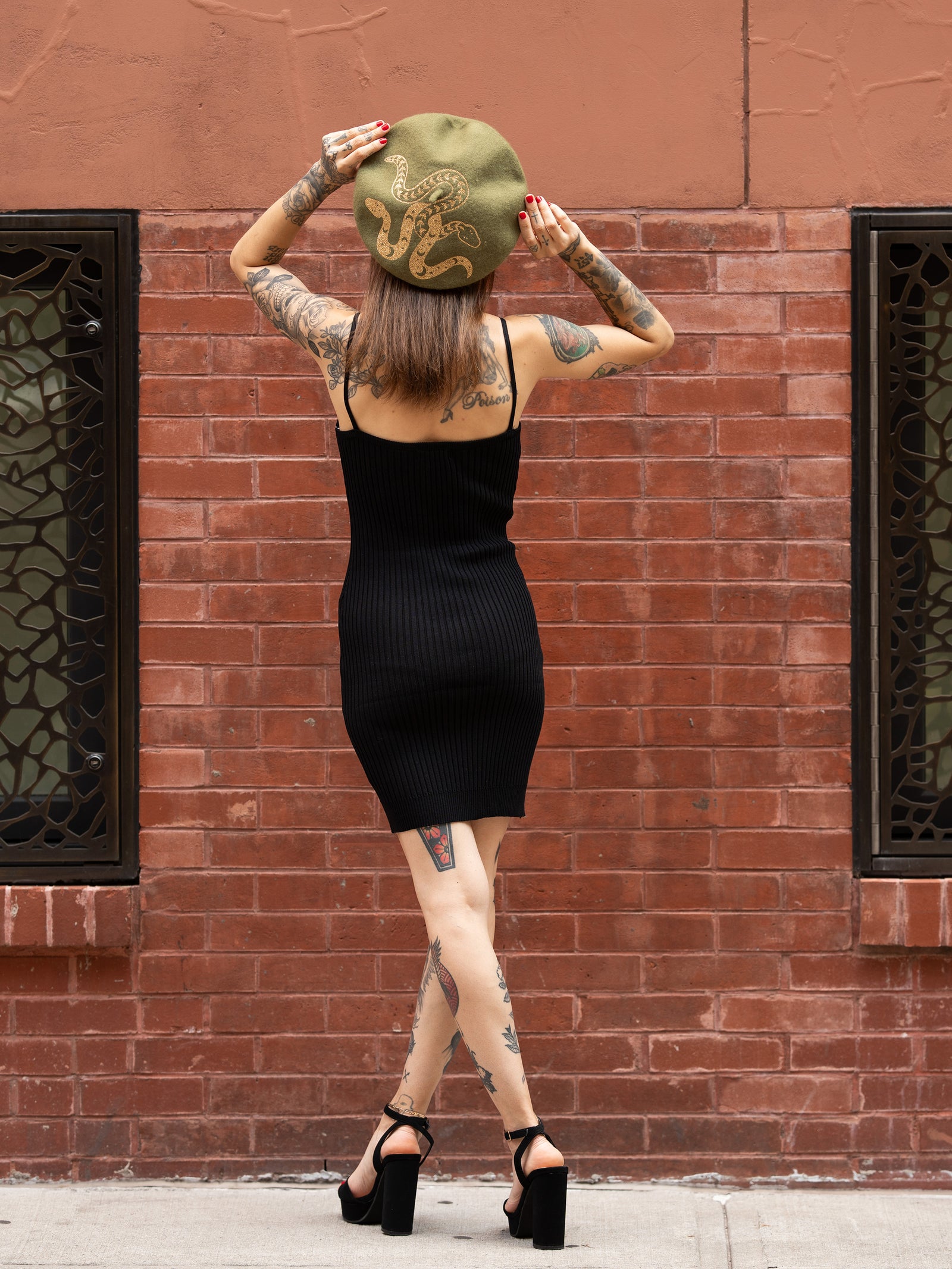 Janice Danger wearing the green and gold Beret with the As She Was black dress