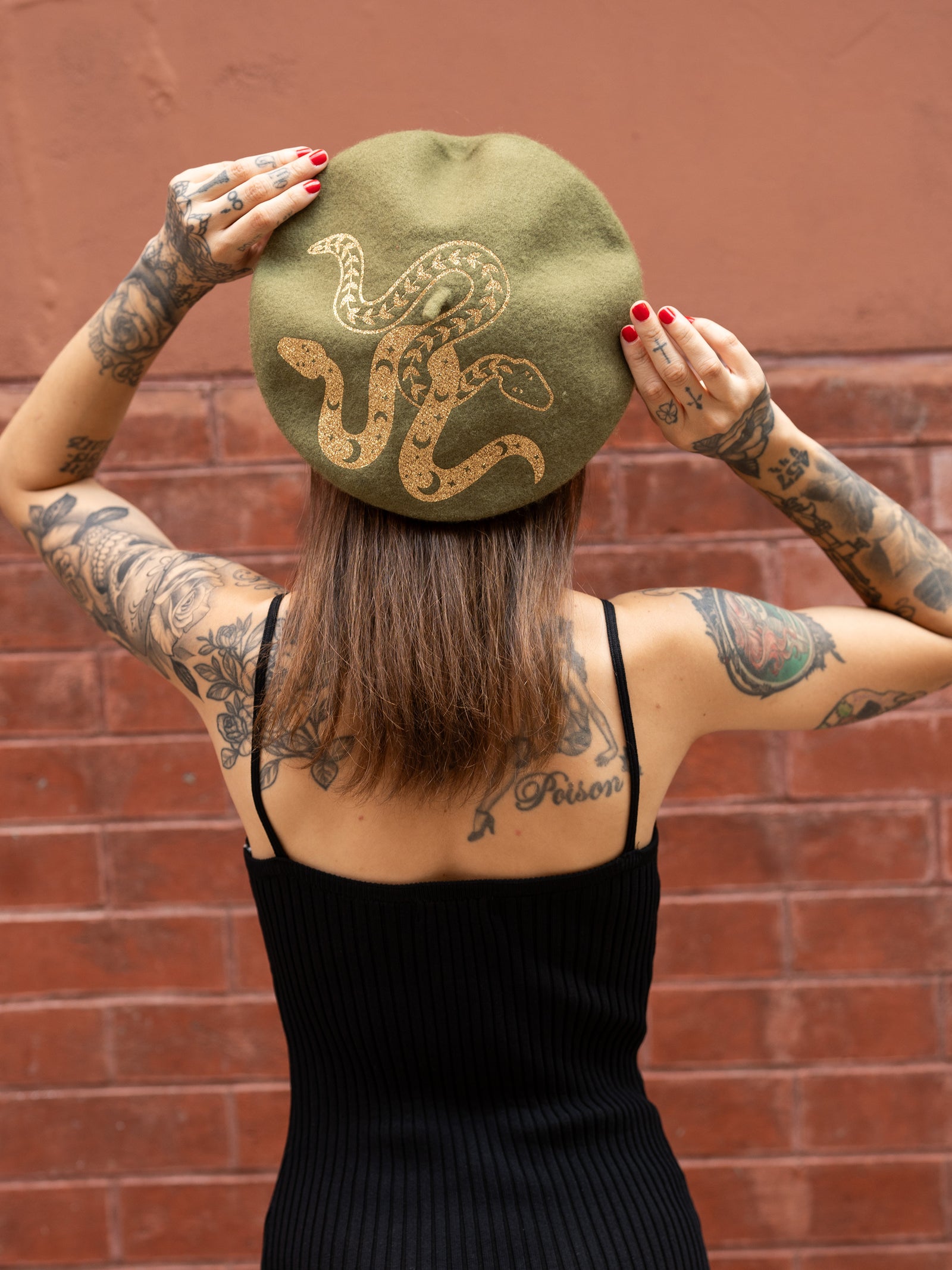 Janice Danger wearing the green and gold Beret with the As She Was black dress