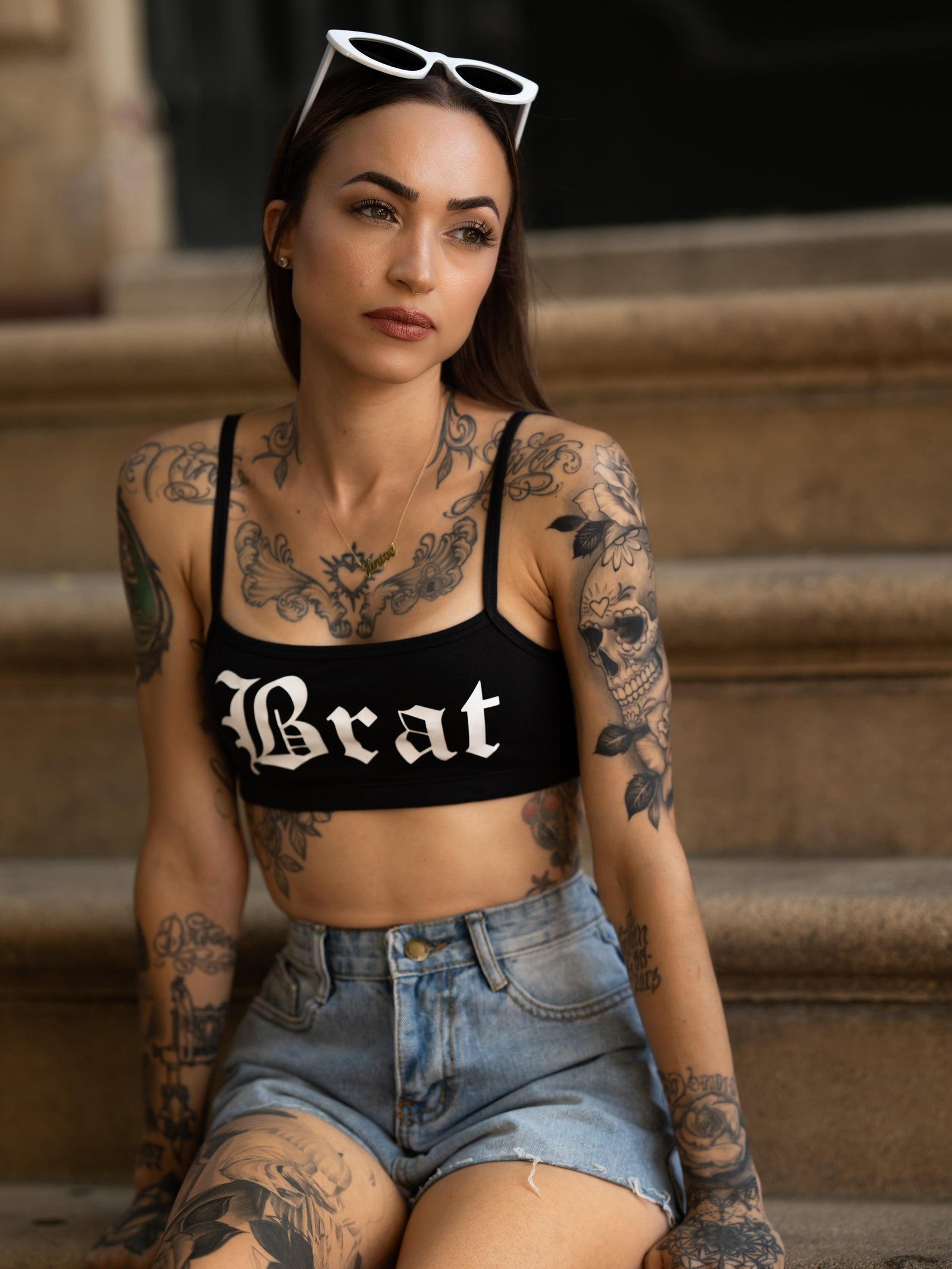 Janice Danger wearing the Brat black bralette with blue denim shorts