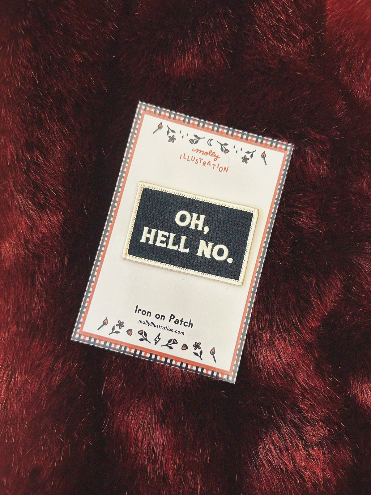Iron-on patch with 'OH, HELL NO.' text on a red faux fur background