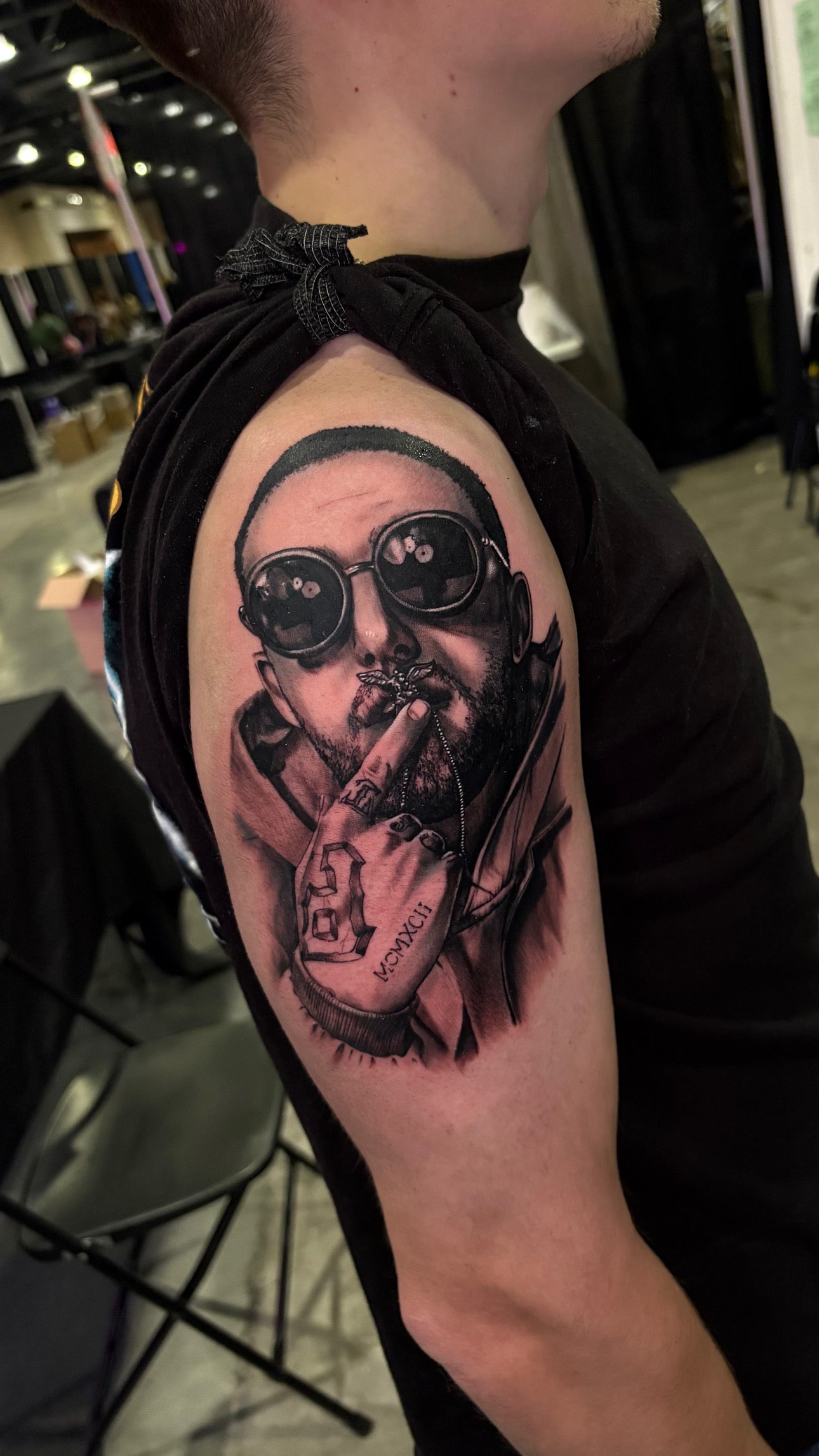 Black and gray realism upper arm tattoo of Mac Miller made by Joanna Gacek. 
