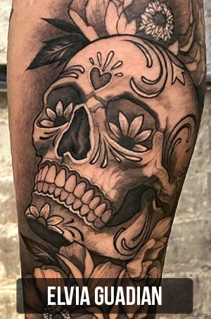 black and gray day of the dead style sugar skull tattoo by Elvia Guadian with link to her tattoo portfolio