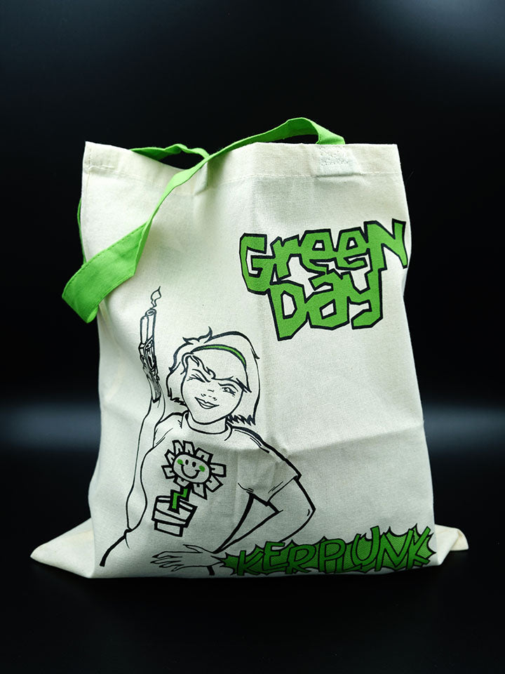 Green Day Kerplunk canvas tote bag with green handles on a black background.