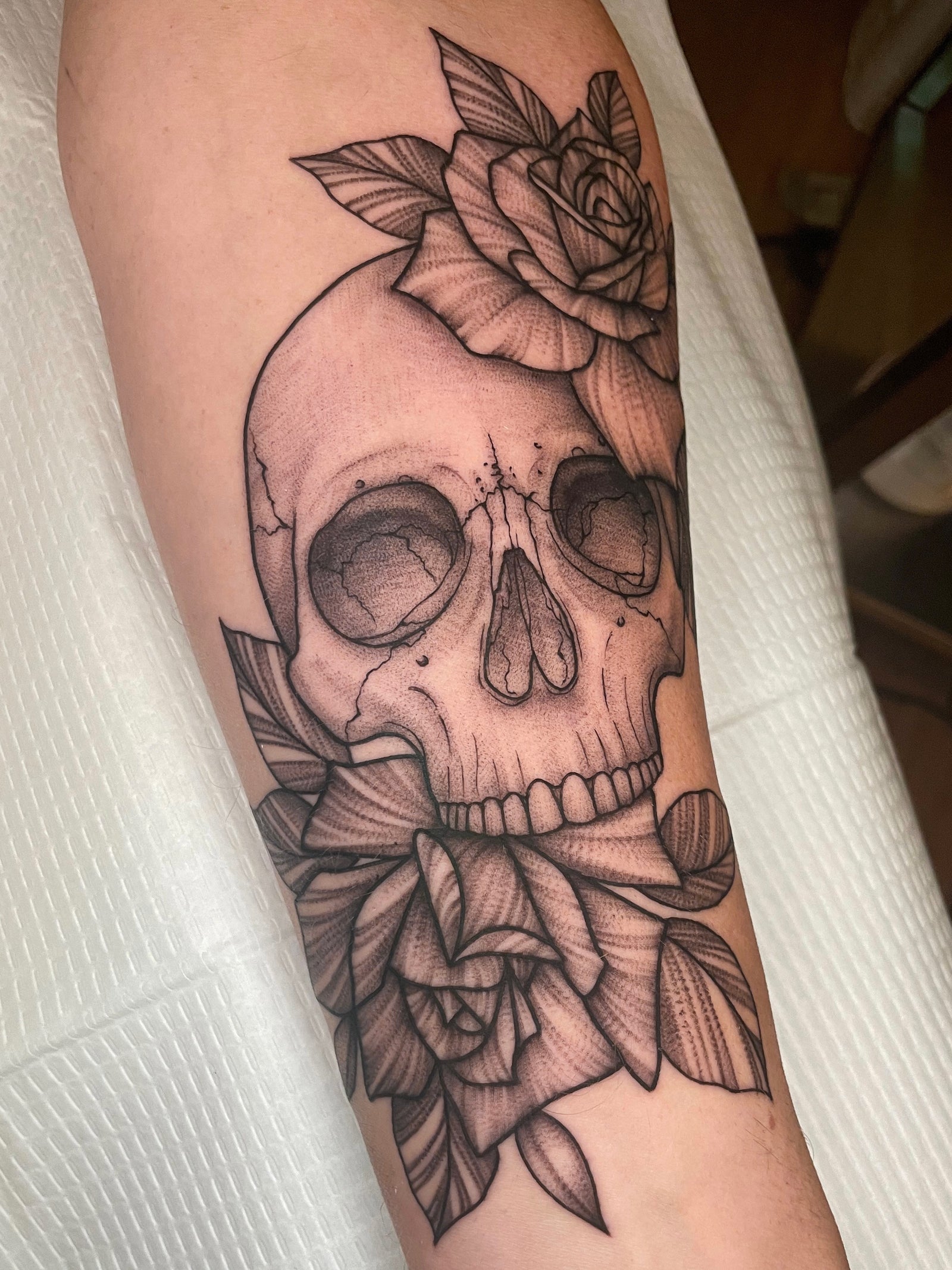 Blackwork fineline  skull and roses forearm tattoo by Janice Danger