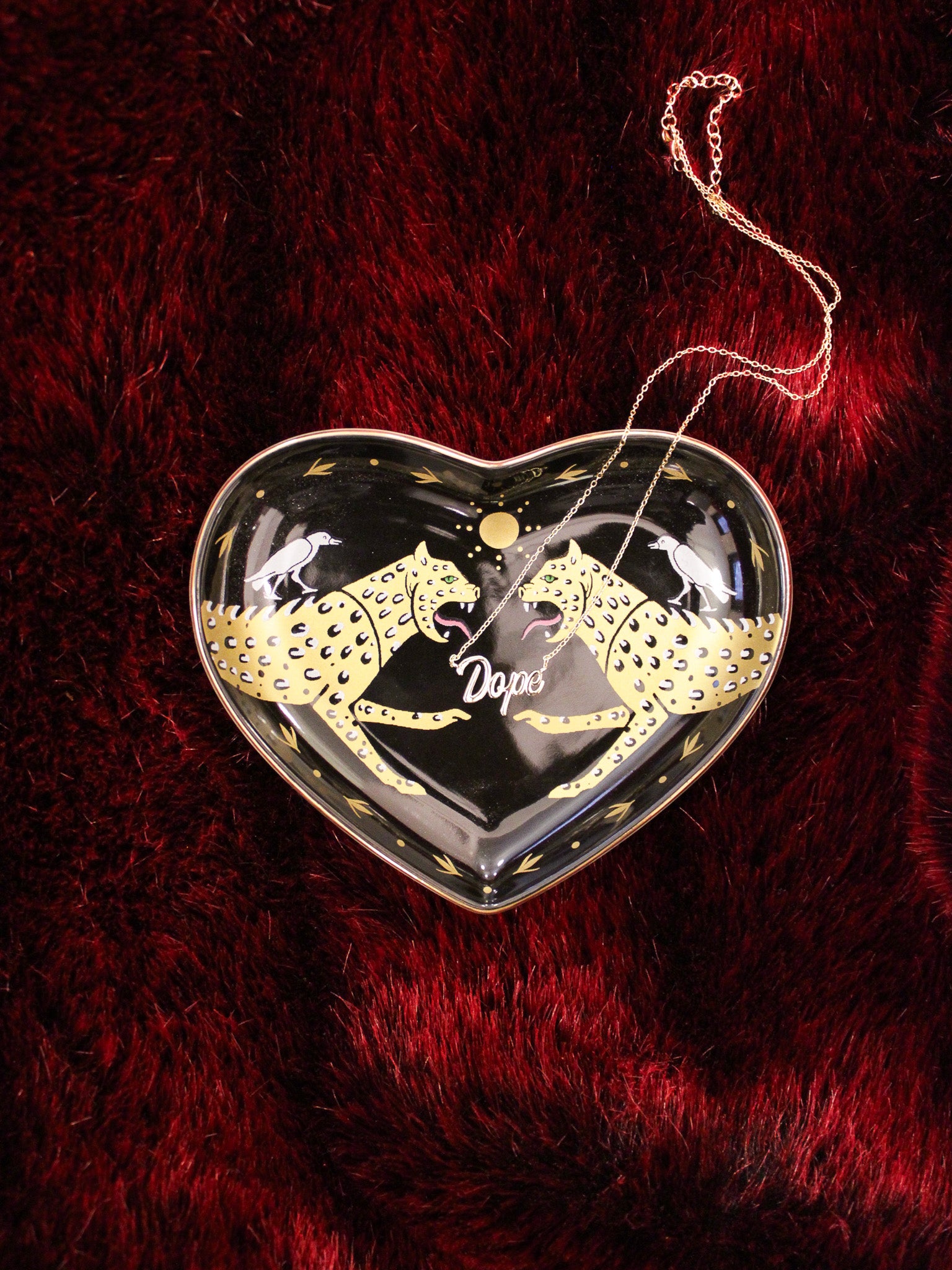 ceramic heart shaped black dish with gold cheetahs