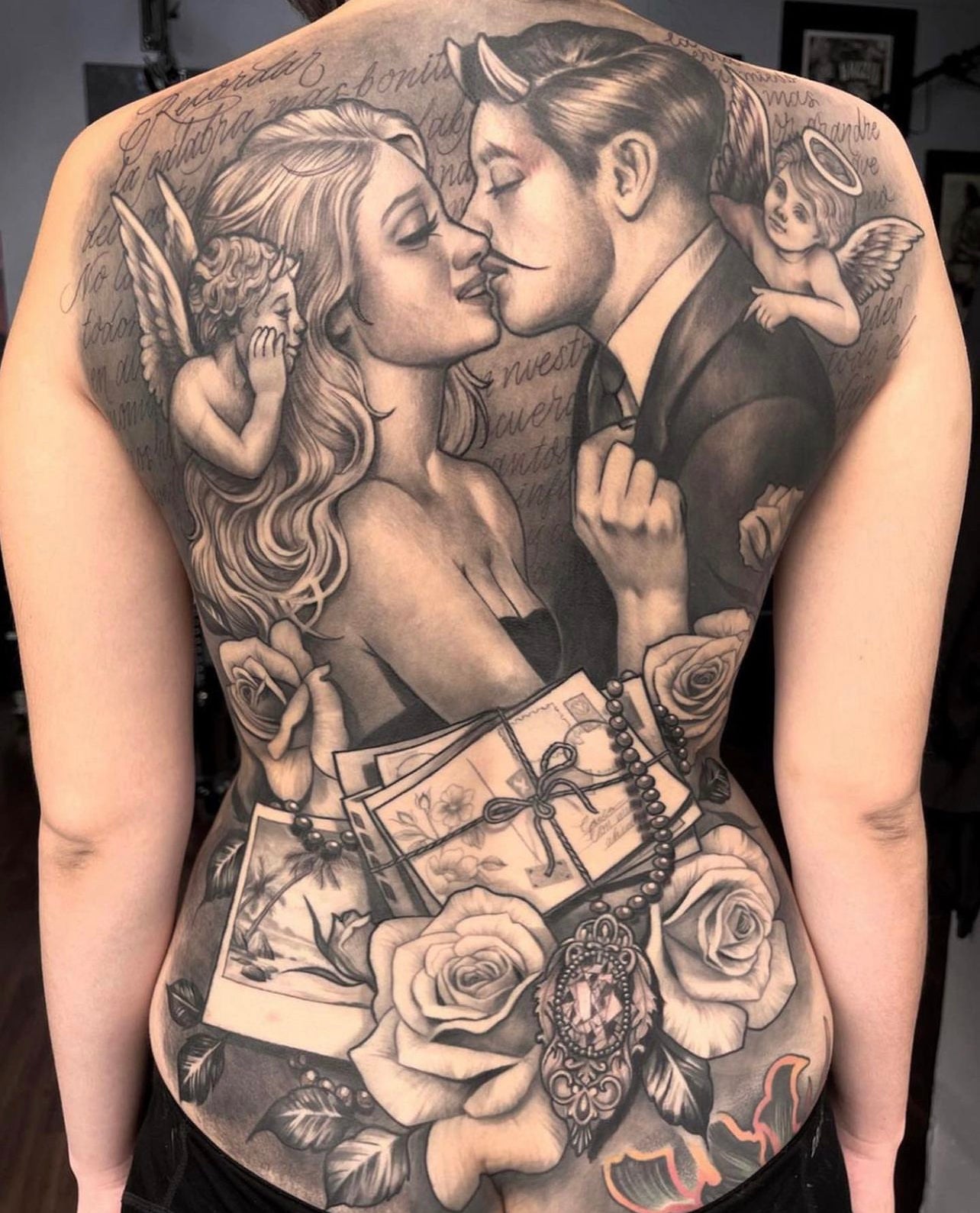 black and gray back piece tattoo by Elvia Guadian