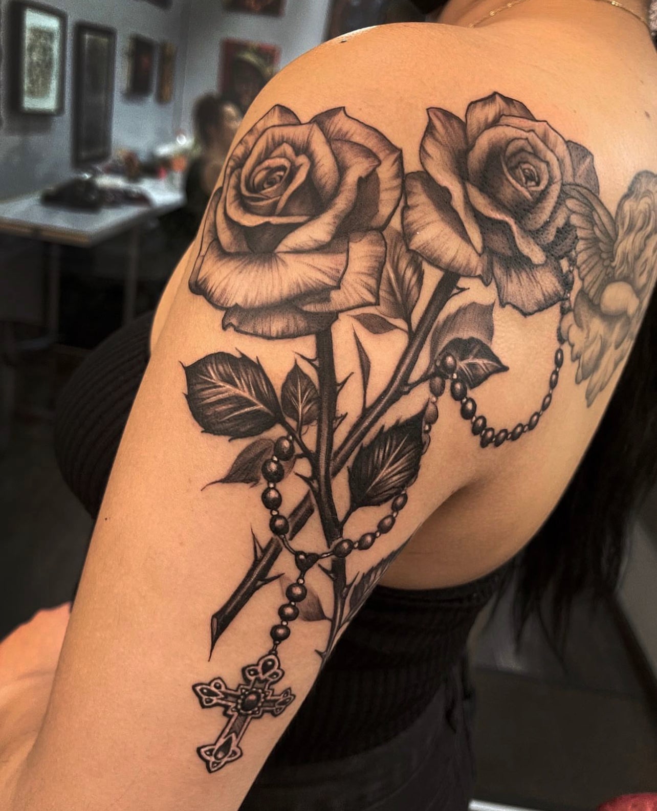 black and gray roses and rosary tattoo by Elvia Guadian 