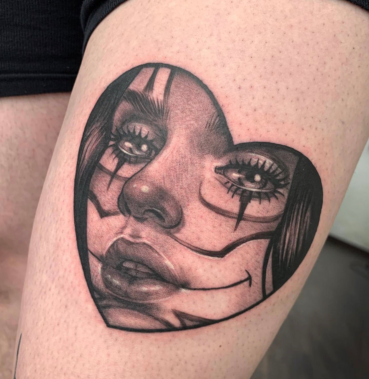 heart shaped black and gray clown girl tattoo by Elvia Guadian