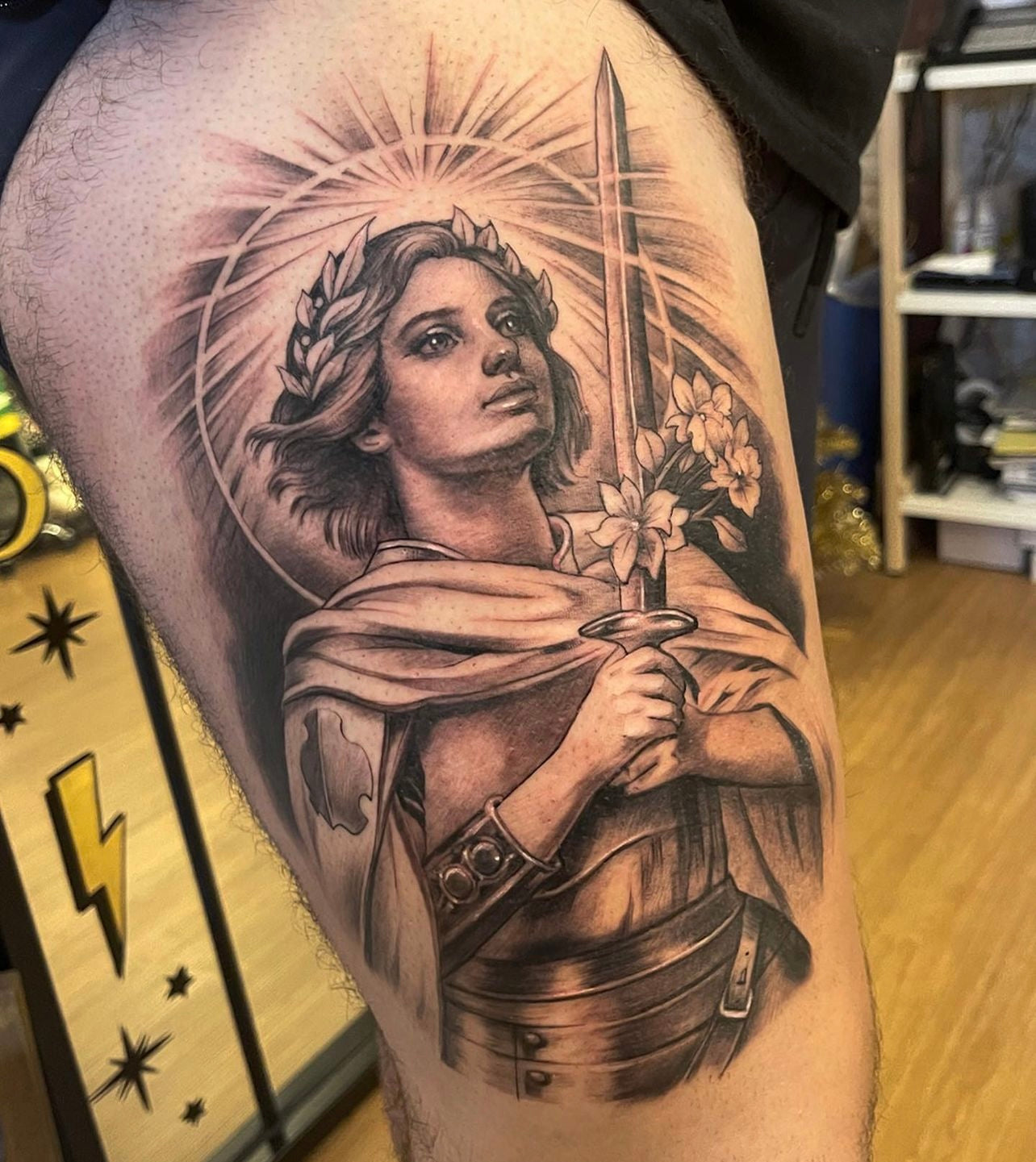Black and Grey Joan of Arc thigh tattoo made by Elvia Guadian 