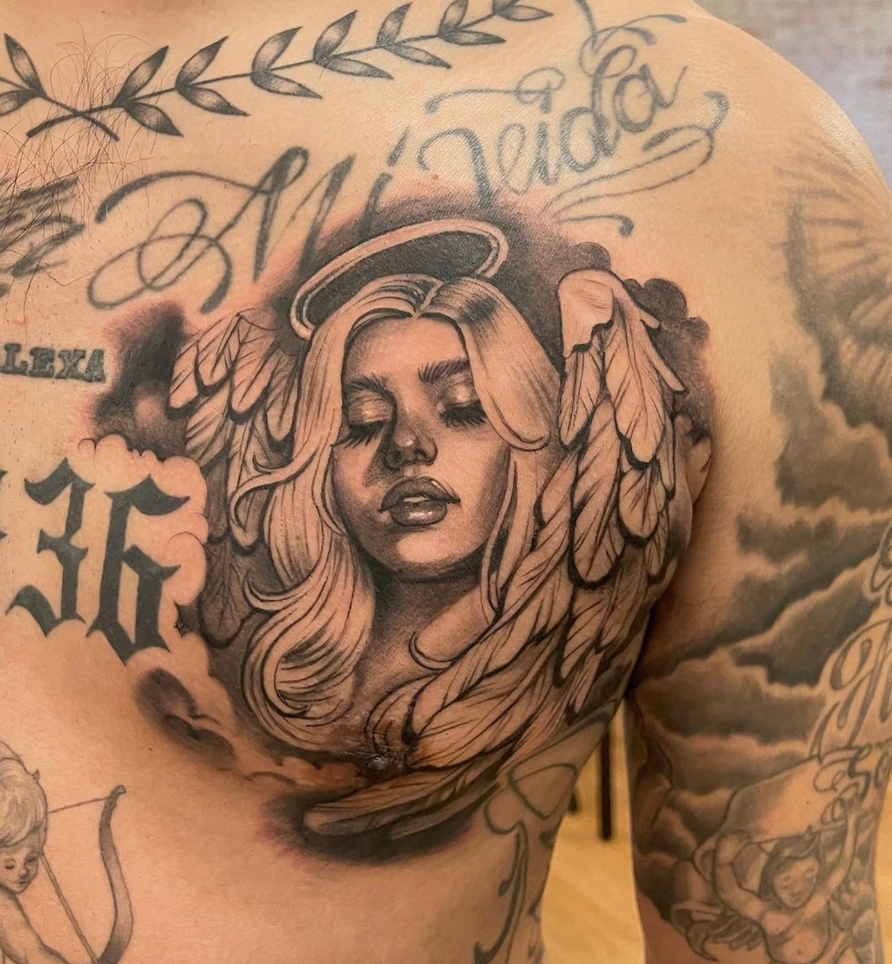 Black and gray angel girl chest tattoo made by Elvia Guadian