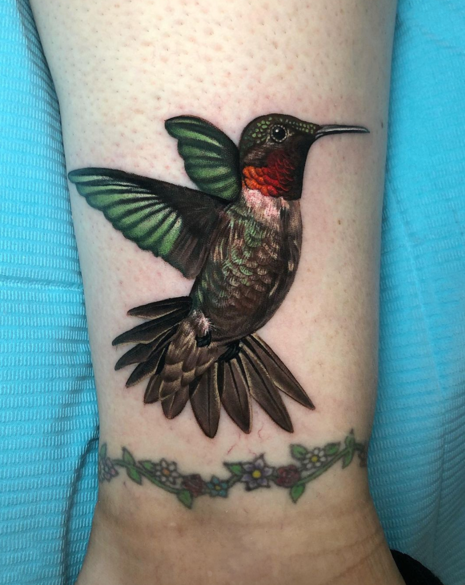 Hummingbird cover up tattoo by Megan Massacre