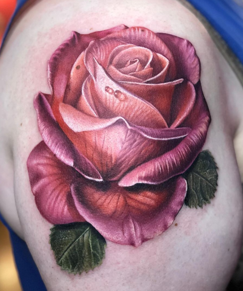 Photorealistic rose tattoo by Megan Massacre