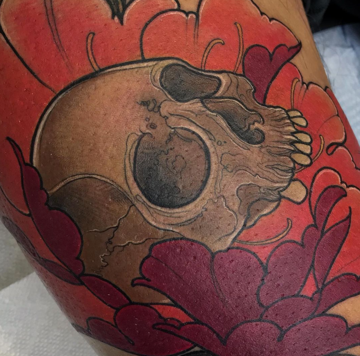Floral skull neo traditional color tattoo by Charlotte Timmons