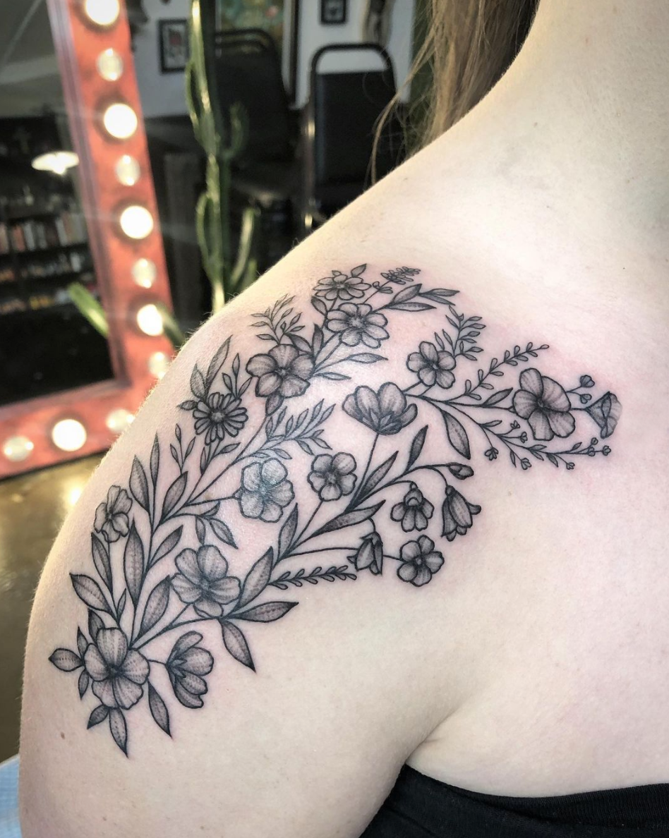 delicate blackwork floral shoulder tattoo by Janice Danger