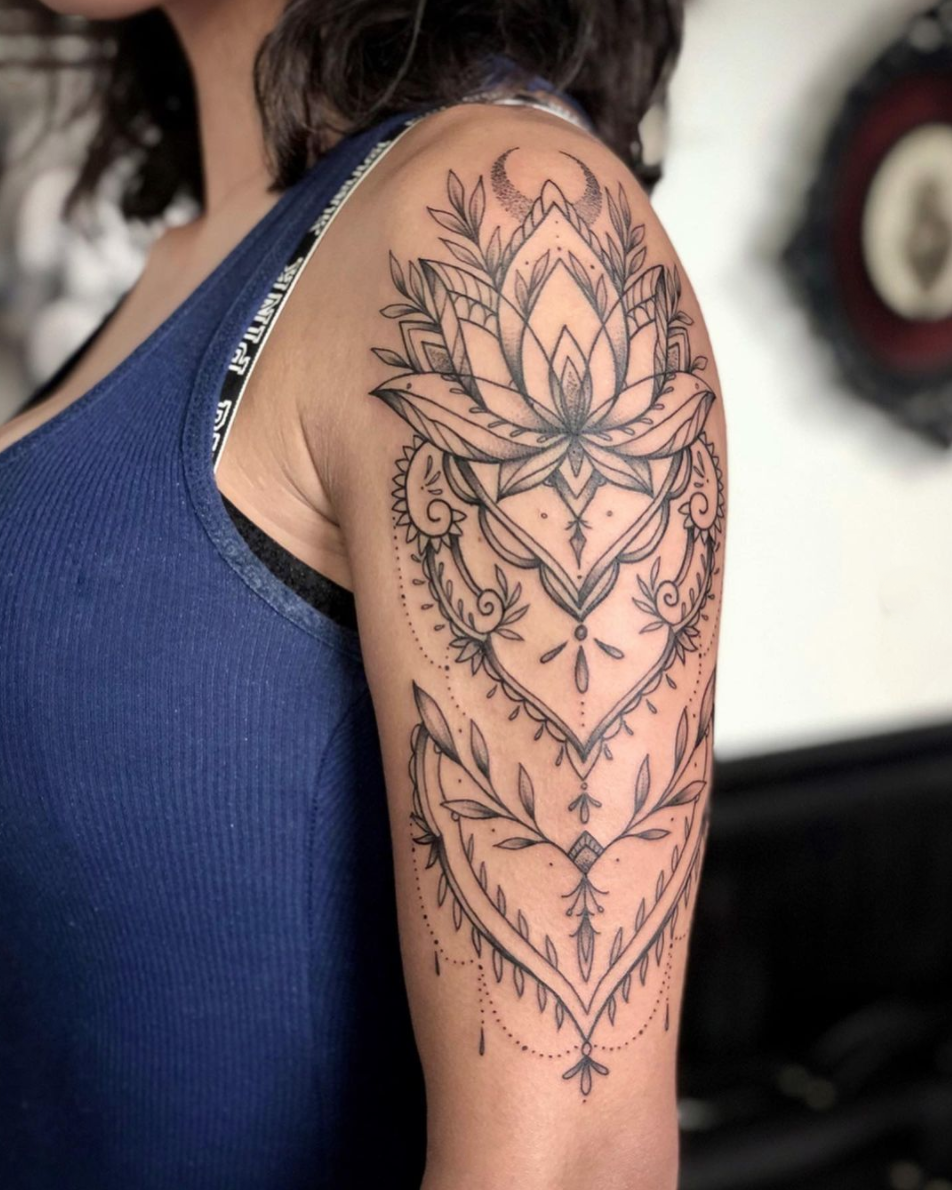 Delicate ornate blackwork fine line arm tattoo by Janice Danger