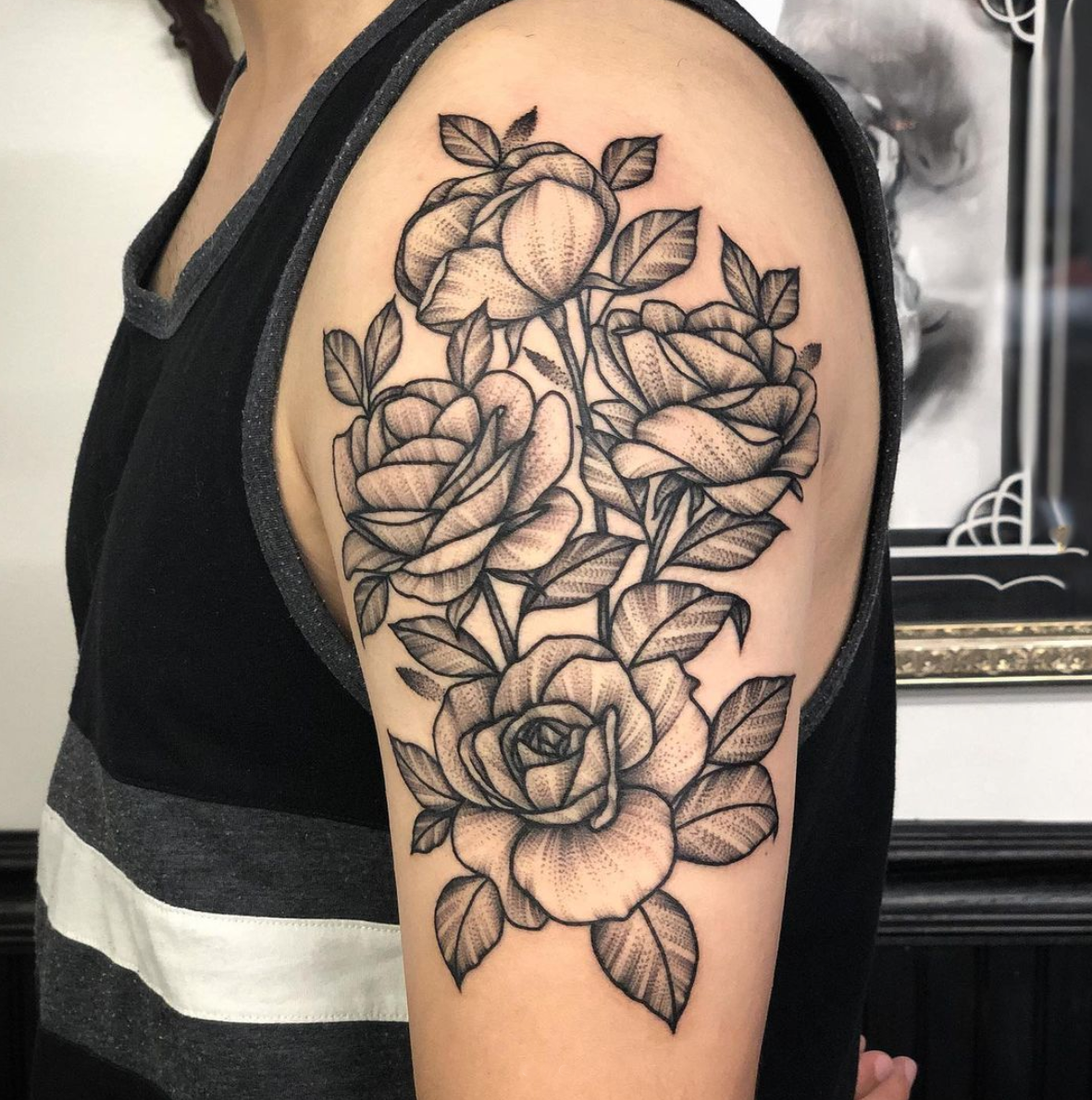 Blackwork rose arm tattoo by Janice Danger