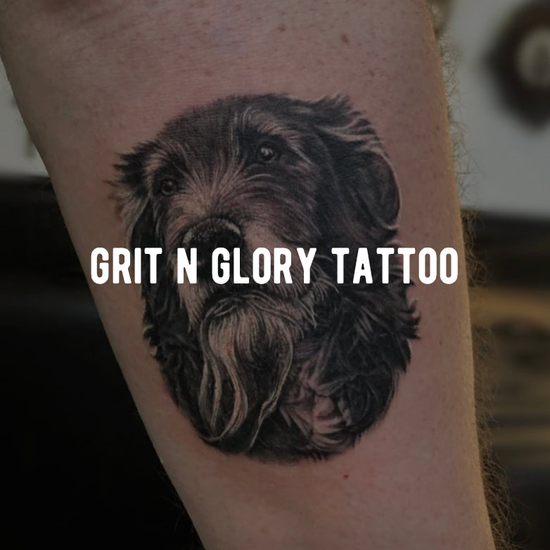 black and gray realism dog portrait arm tattoo by Megan Massacre at Grit N Glory Tattoo Studio in NYC