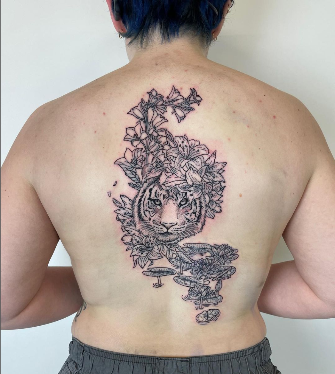 blackwork floral tiger back piece tattoo by Mehak Basu