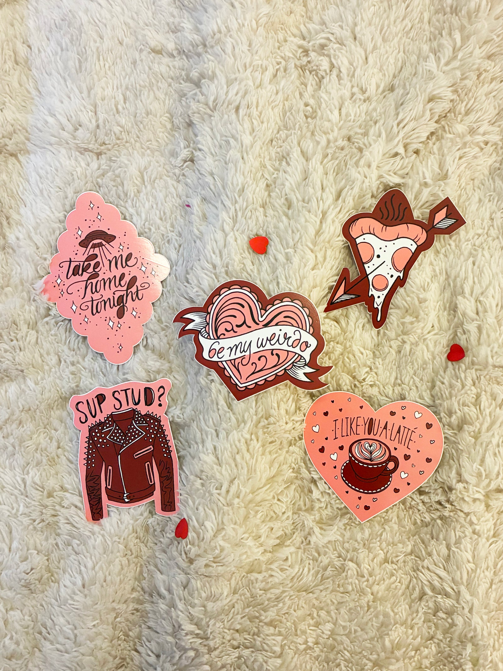 pink and red die cut sticker pack on a fuzzy off white background