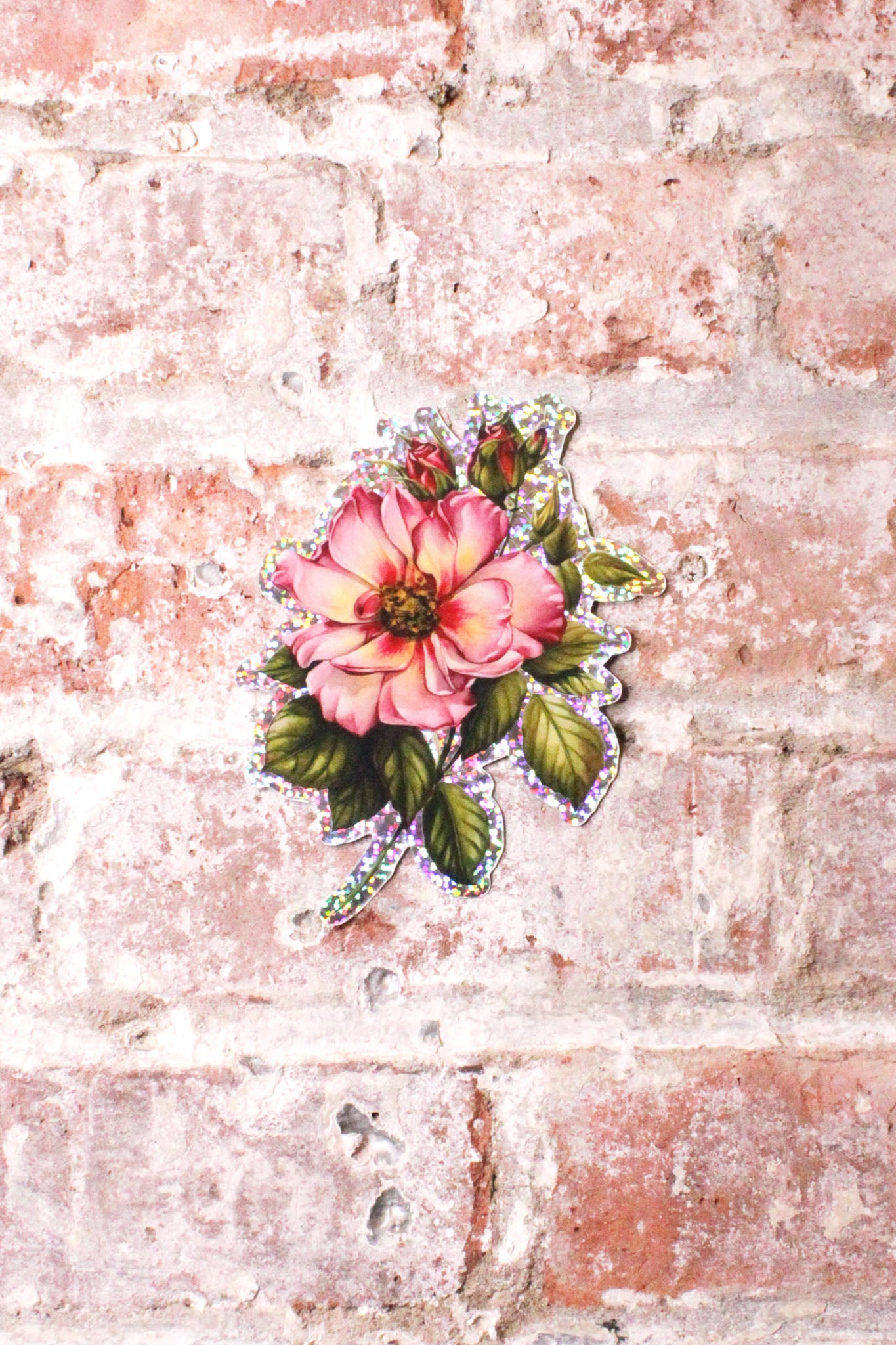 Grit N Glory Tattoo Artist Makkala Rose's shimmery rose sticker featuring one open rose and two buds. 