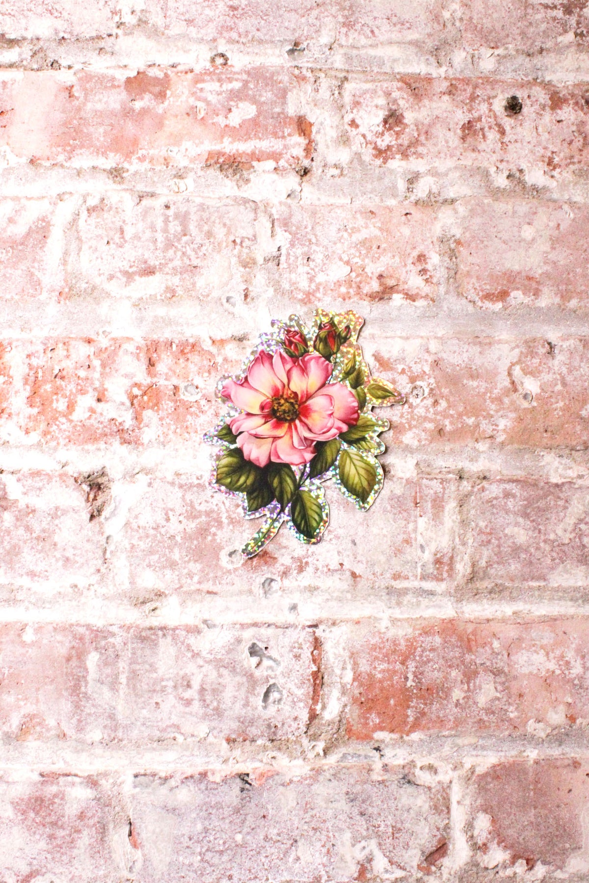 Grit N Glory Tattoo Artist Makkala Rose's shimmery rose sticker featuring one open rose and two buds. 