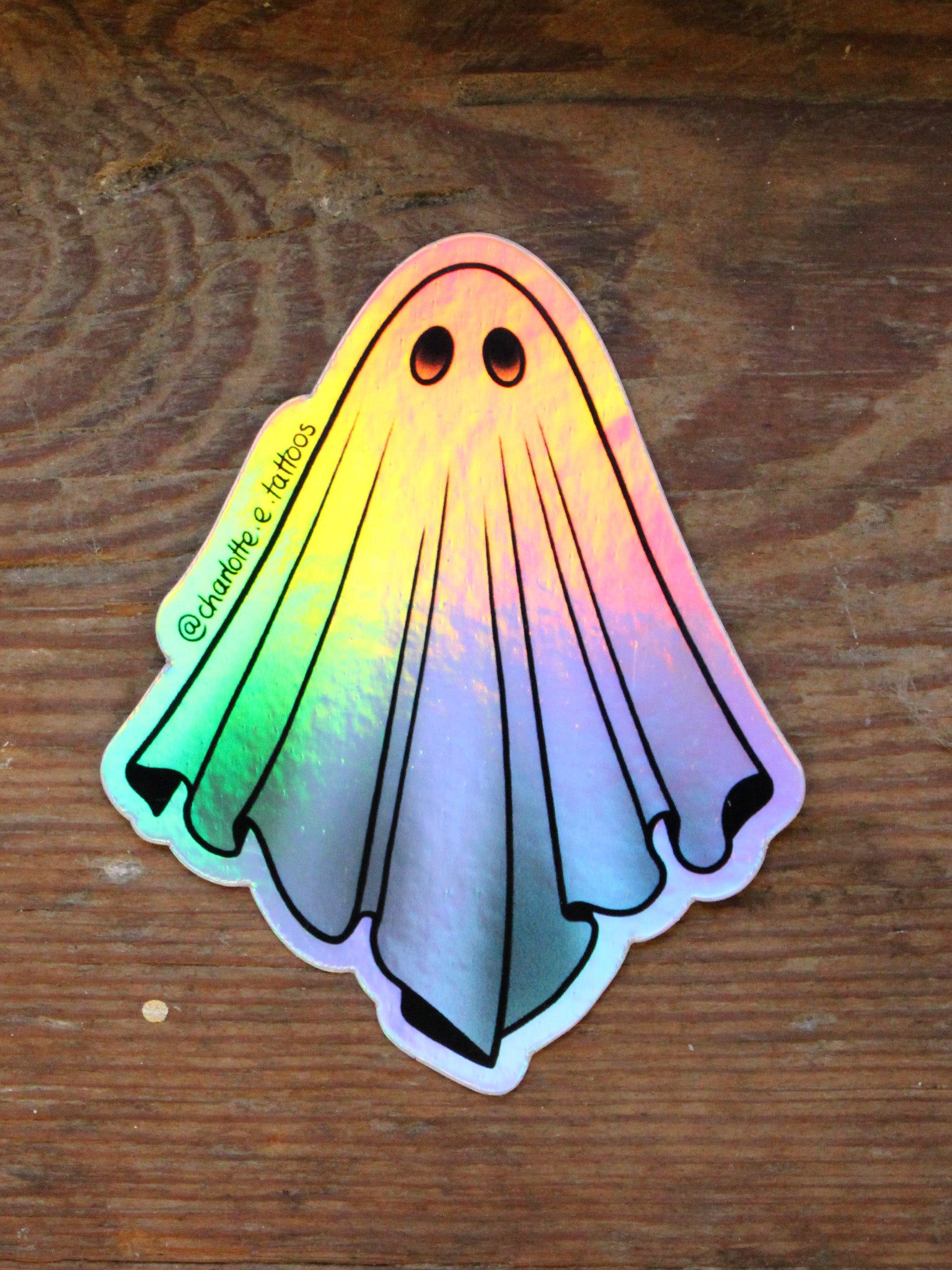 Holographic Ghost Sticker