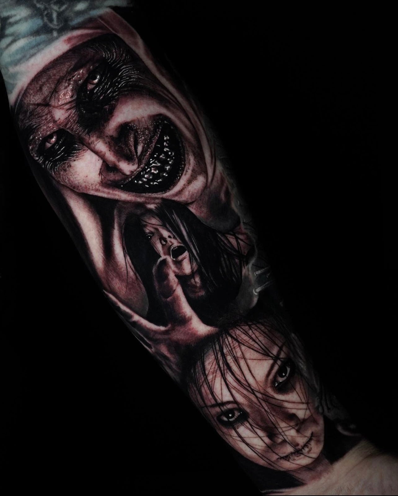 Black and realism horror themed arm tattoo by Joanna Gacek
