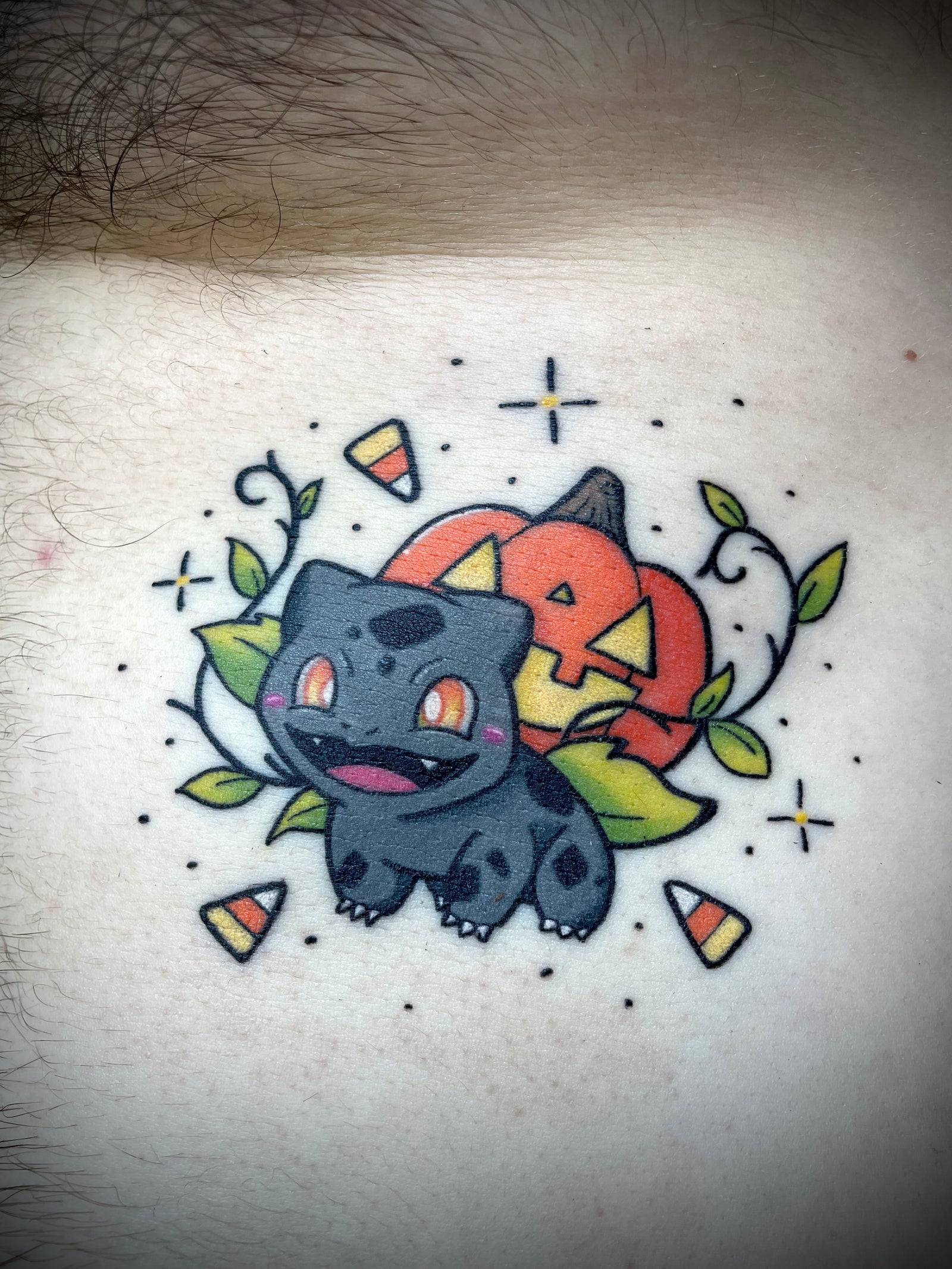 Cute and Halloween themed Bulbasaur Pokemon Jack o Lantern candy corn color tattoo by Jessica V spoopy
