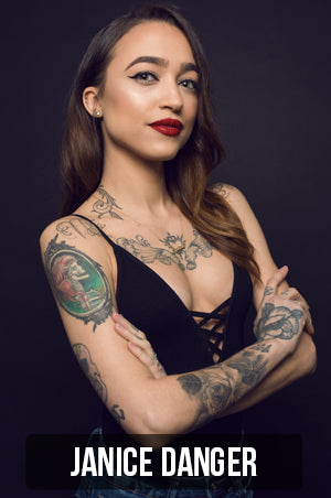 Photograph of Janice Danger on a black background. Janice specializes in delicate fine line and blackwork tattoos. Link to her portfolio page