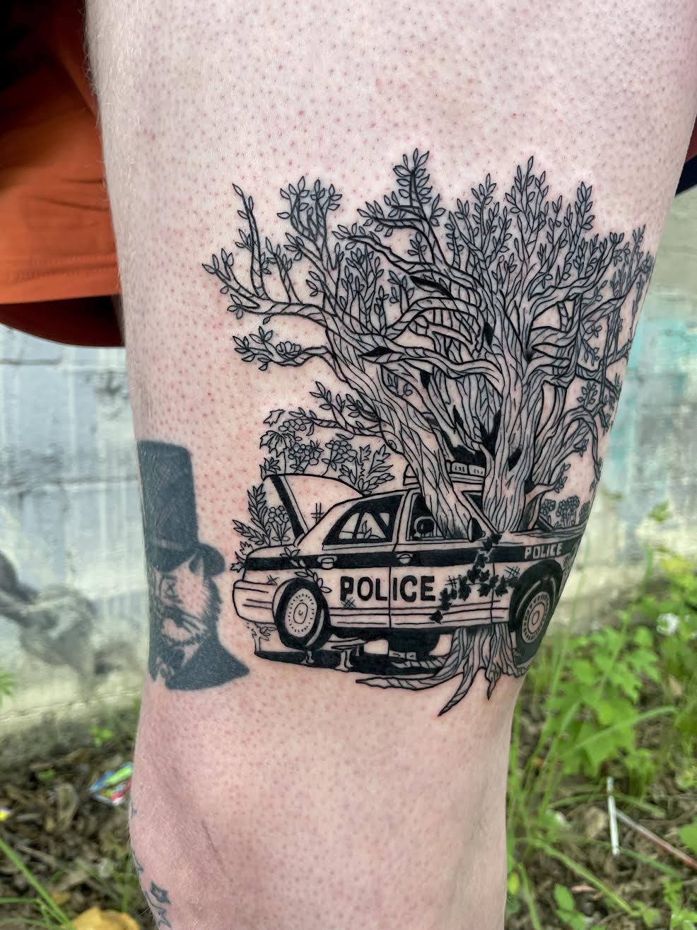blackwork police car tree tattoo by Mehak Basu
