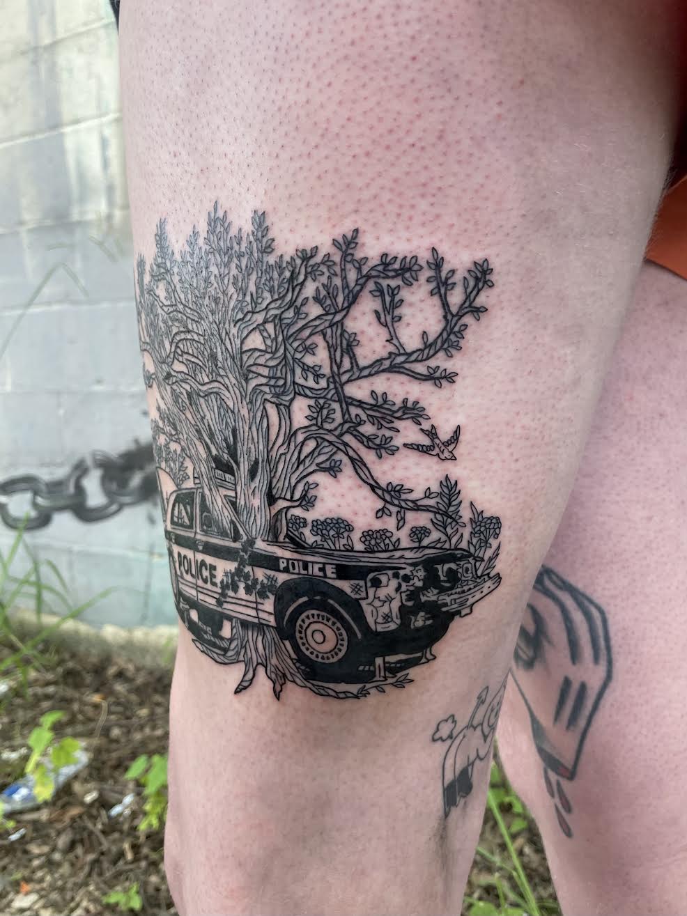 blackwork police car foliage tattoo by Mehak Basu