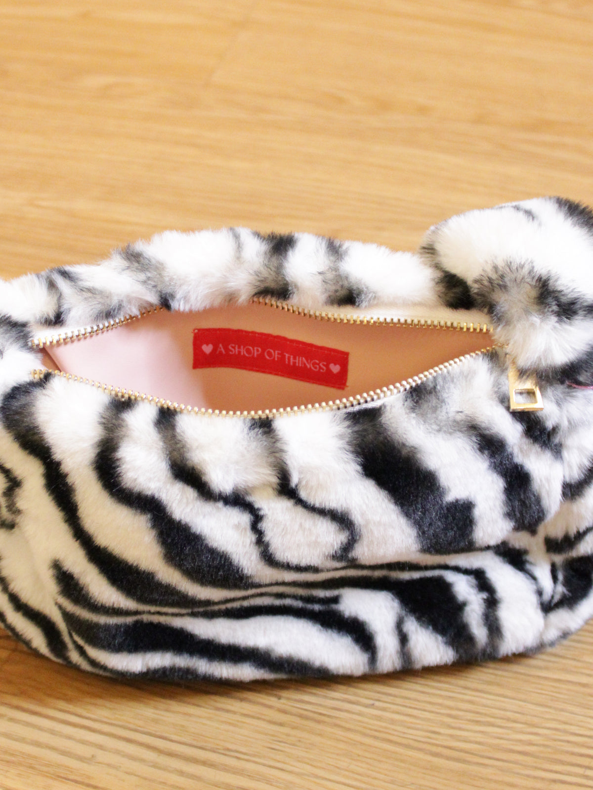 interior and zipper of zebra handbag