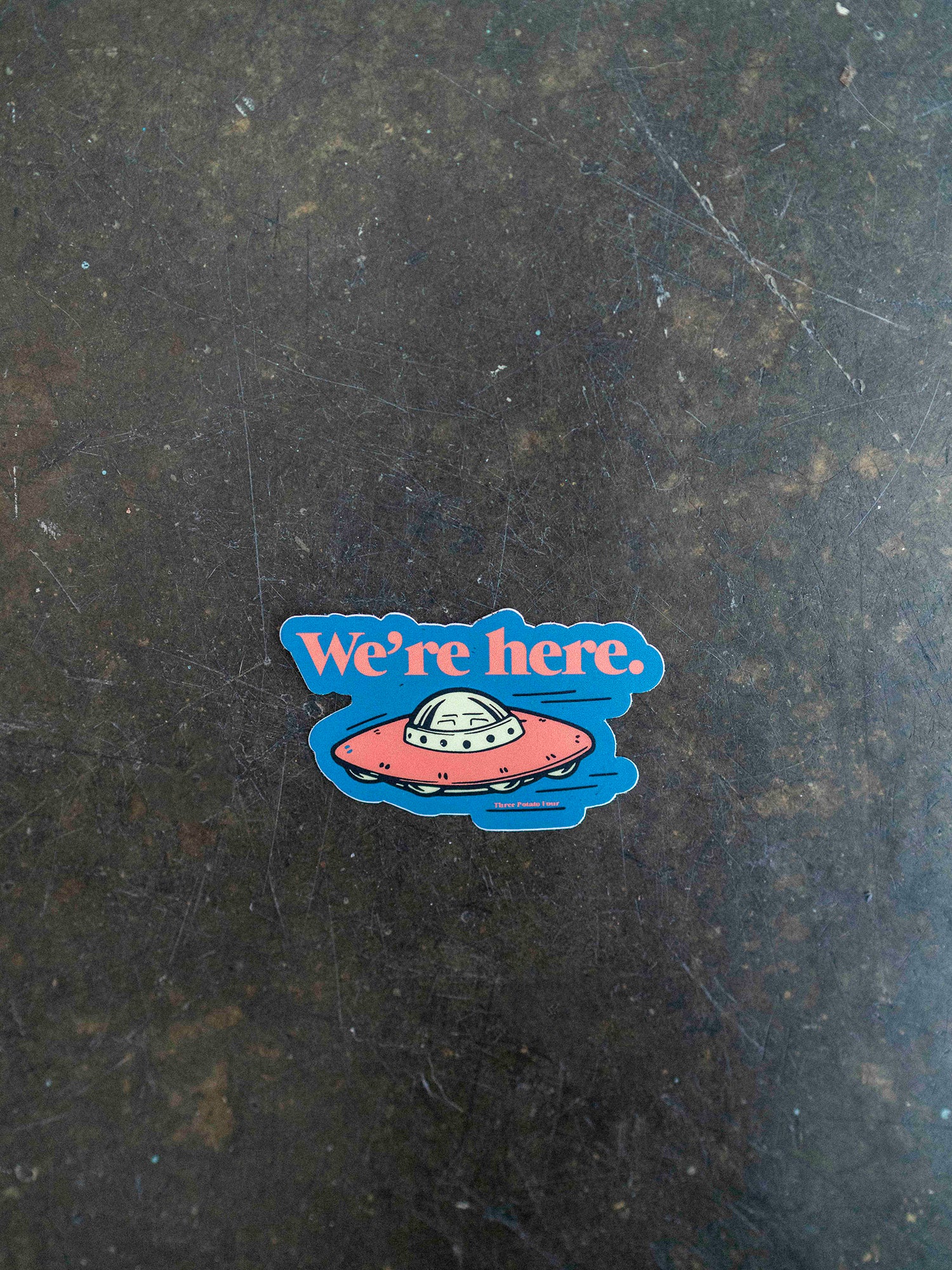 We're Here Sticker