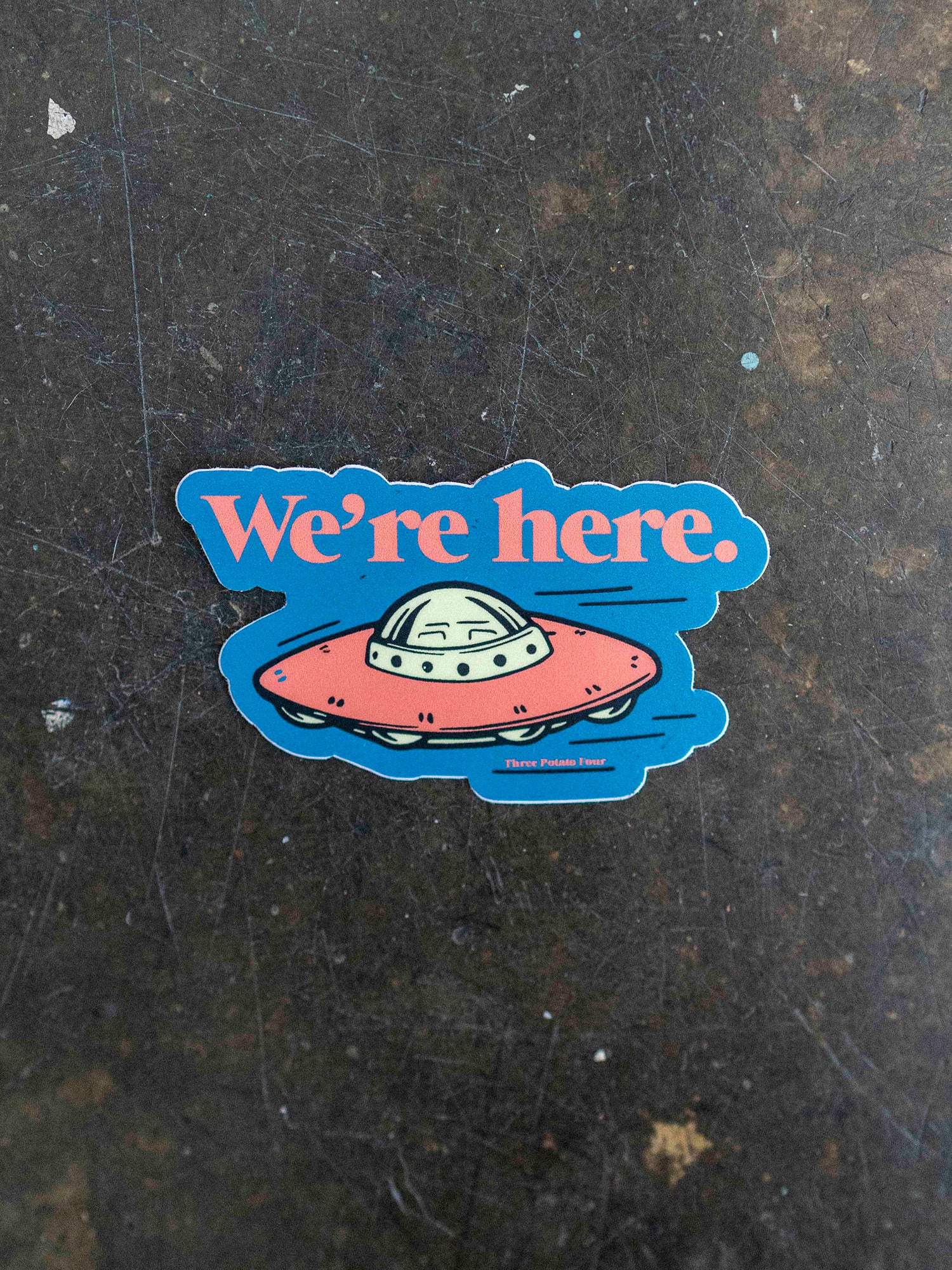 We're Here Sticker