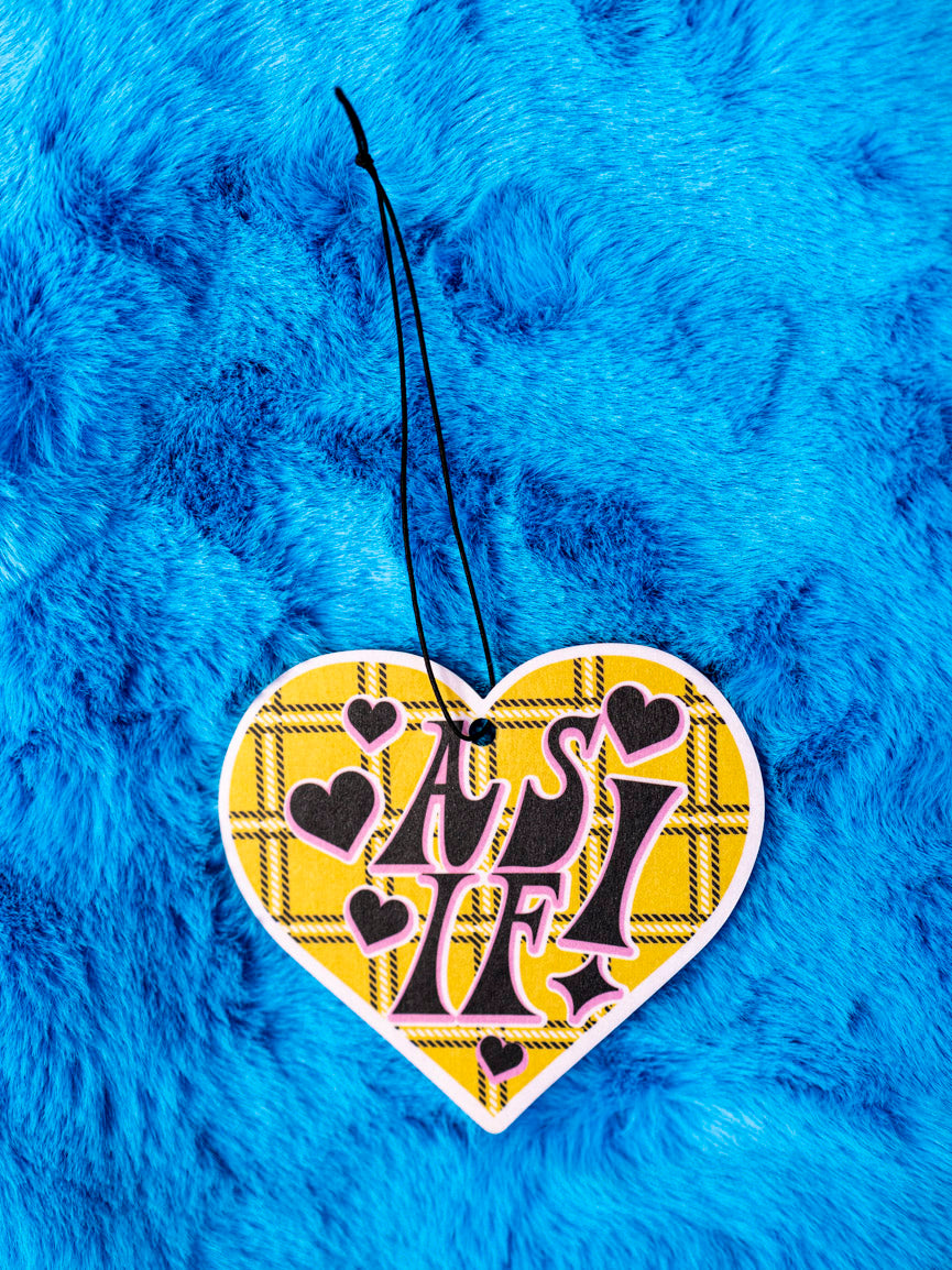 Clueless inspired 90's, heart shaped yellow plaid air freshener on a furry blue background.