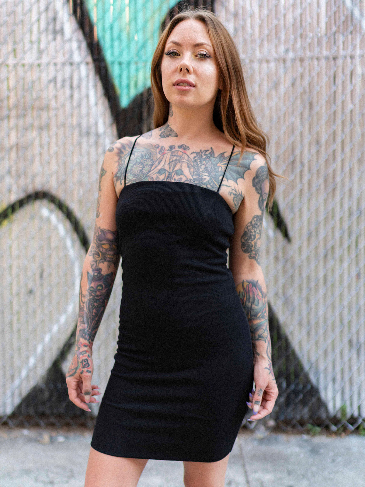 Megan Massacre wearing the black spaghetti strap Take on Me mini dress