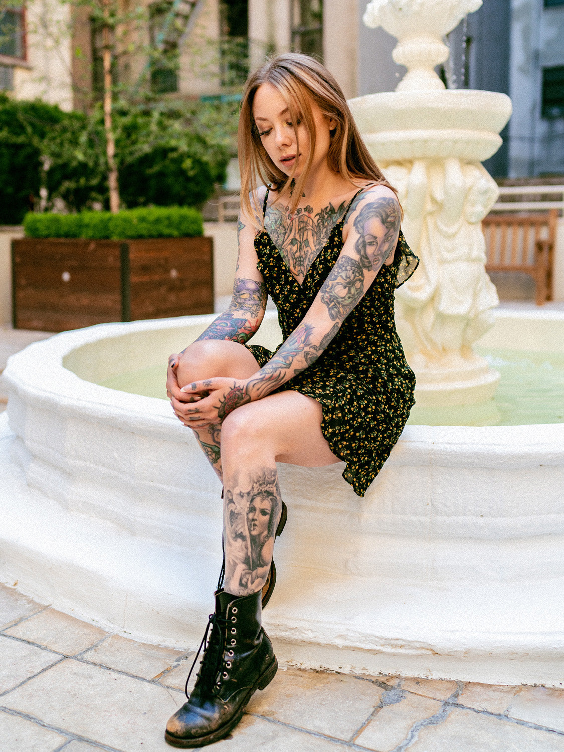 Megan Massacre in the floral patterned Daydreamer Dress with black boots. 