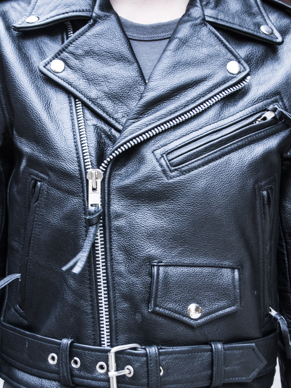Detail of cropped leather classic moto style jacket. 