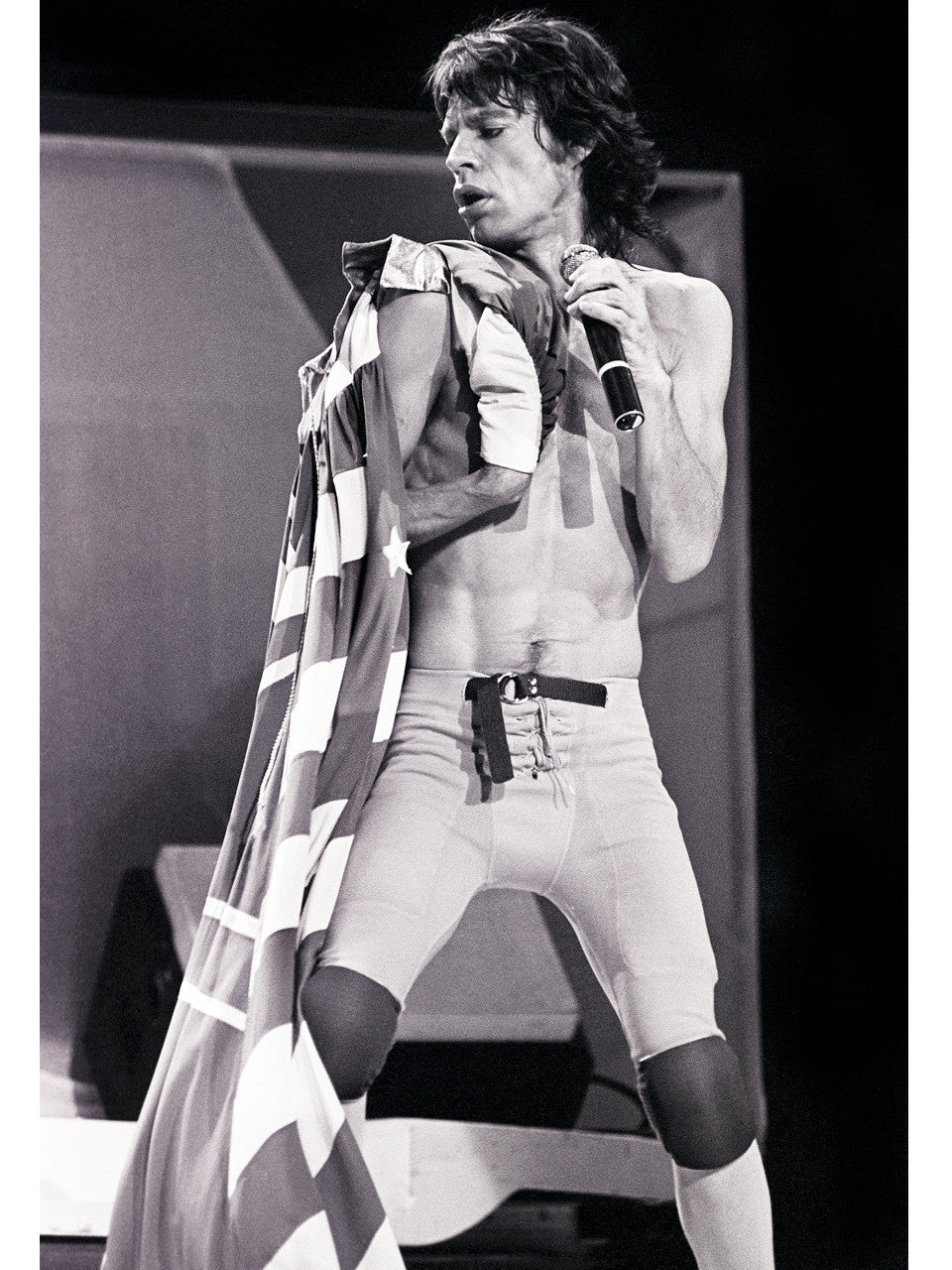 Black and White photograph of Mick Jagger of The Rolling Stones  with a draped fabric photographed by Mark Weiss
